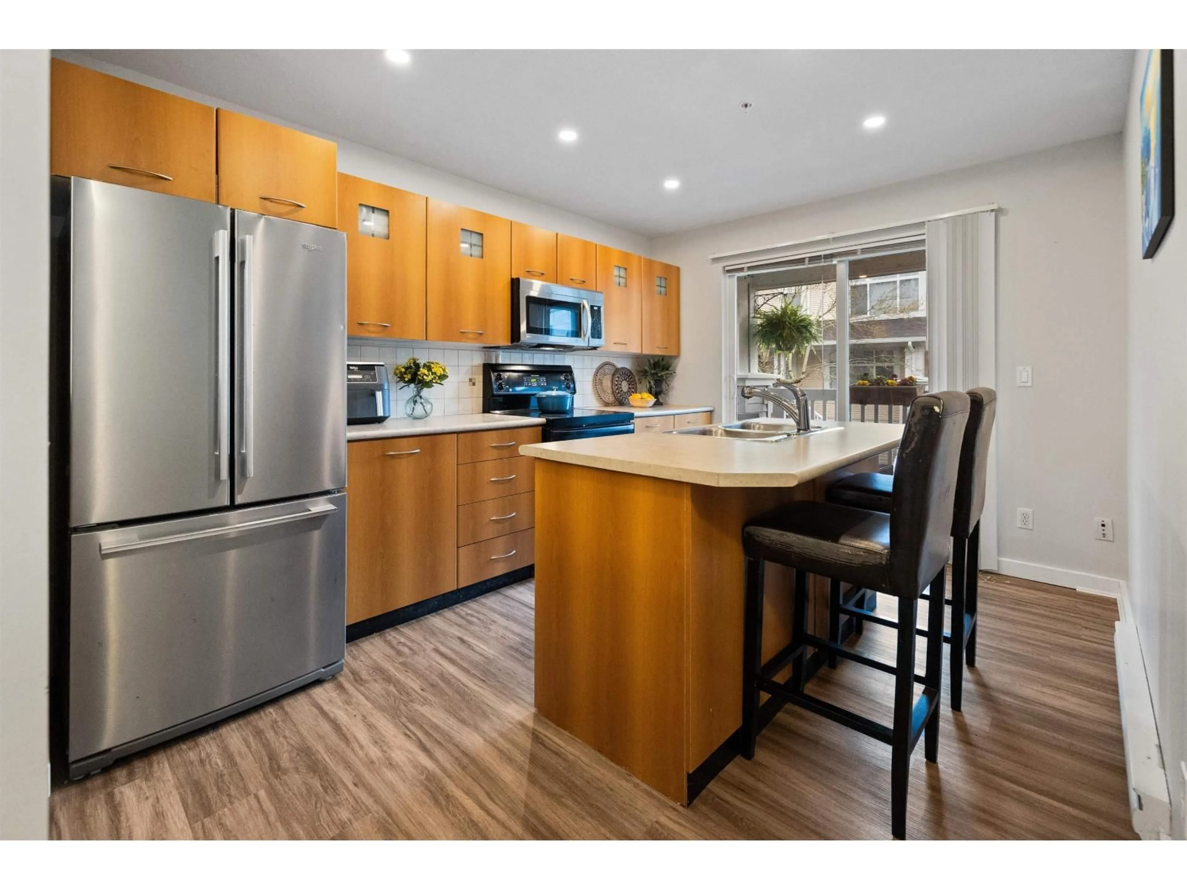 Open concept kitchen, wood/laminate floor for 61 - 7179 201 STREET, Langley British Columbia V2Y2Y9