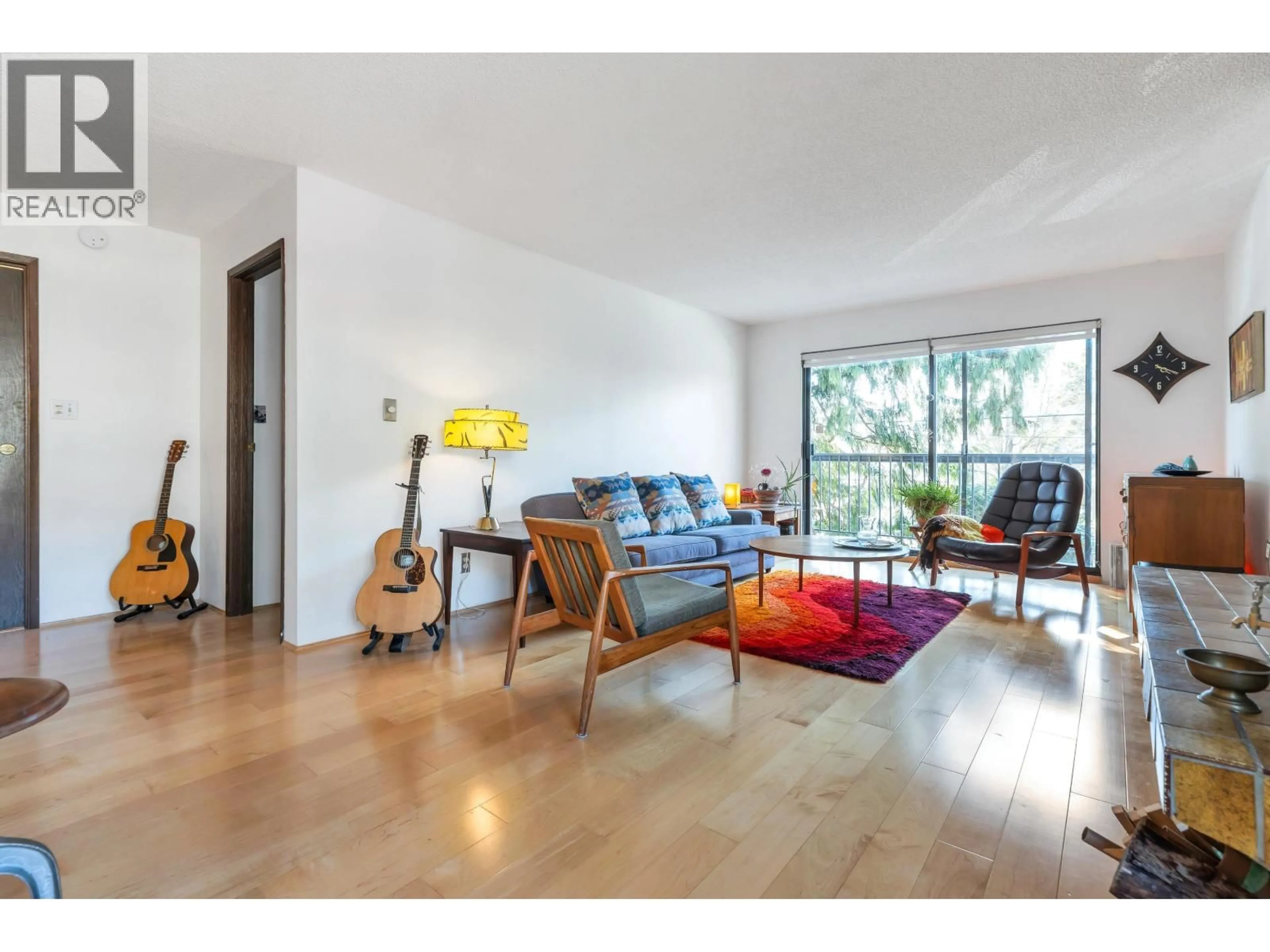 Living room with furniture, wood/laminate floor for 204 - 1515 5TH AVENUE, Vancouver British Columbia V5N1L6