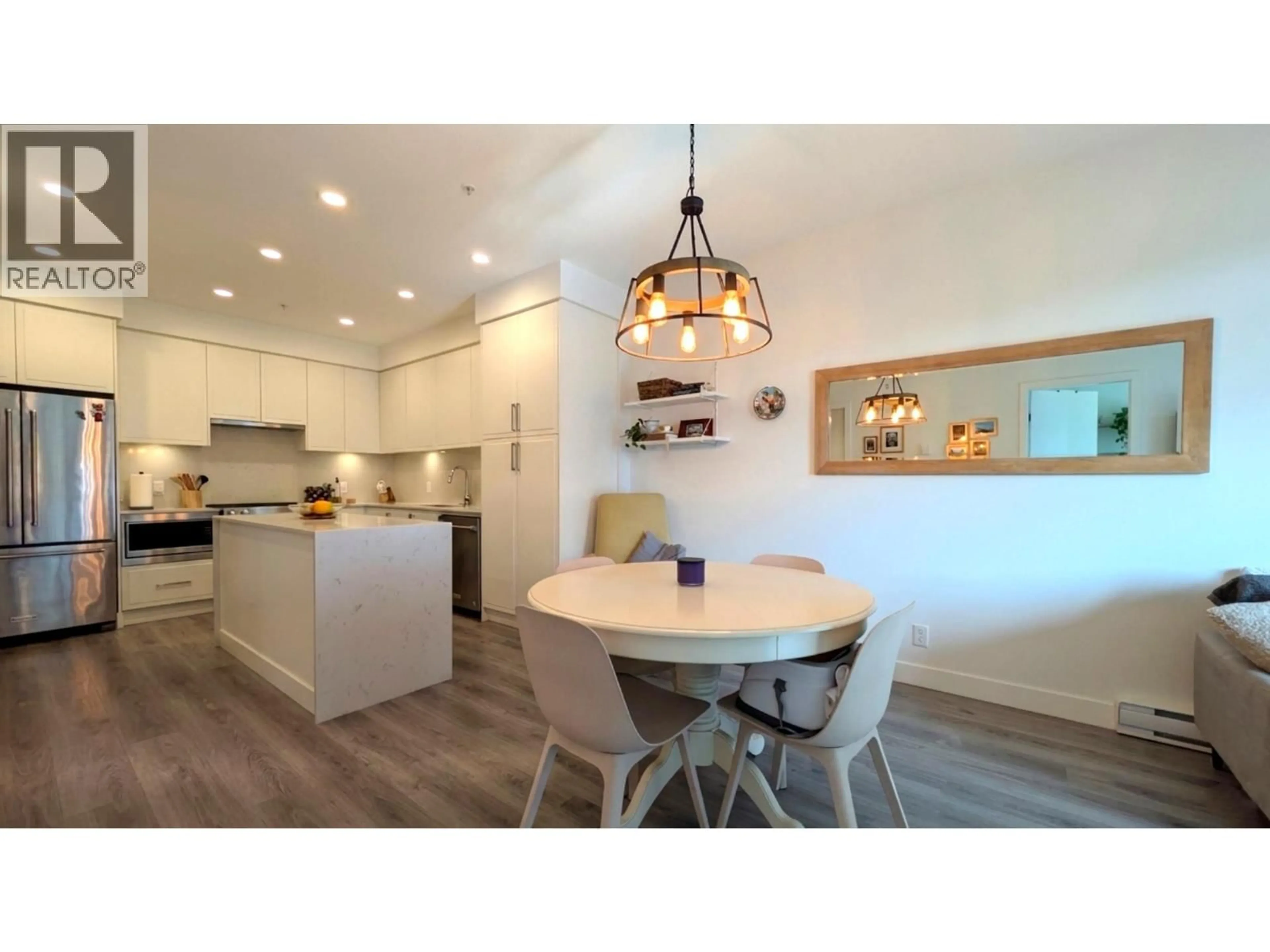 Open concept kitchen, wood/laminate floor for 402 - 700 CLARKE ROAD, Coquitlam British Columbia V3J0K5