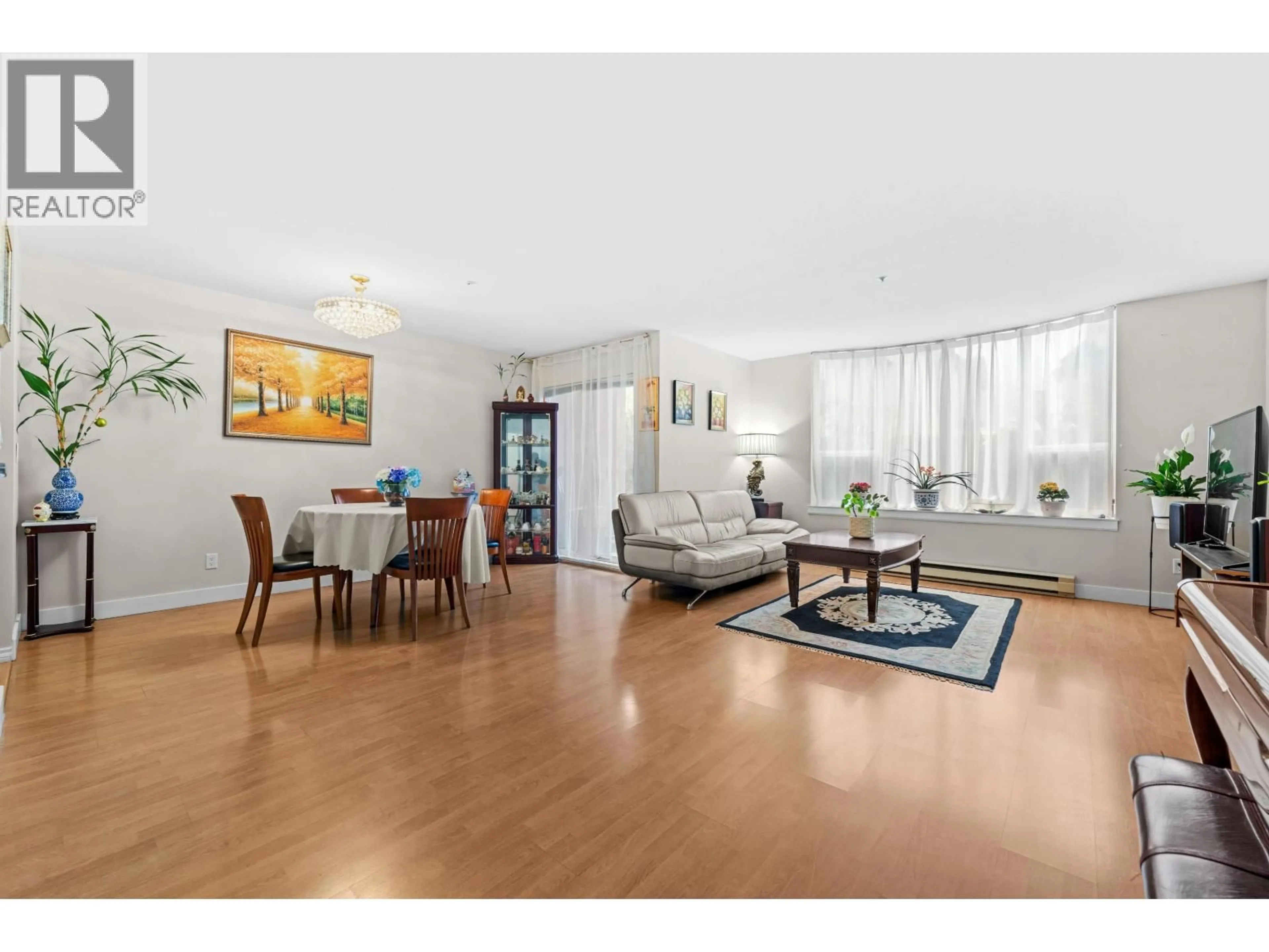 Living room with furniture, wood/laminate floor for 133 - 8300 GENERAL CURRIE ROAD, Richmond British Columbia V6Y3X1