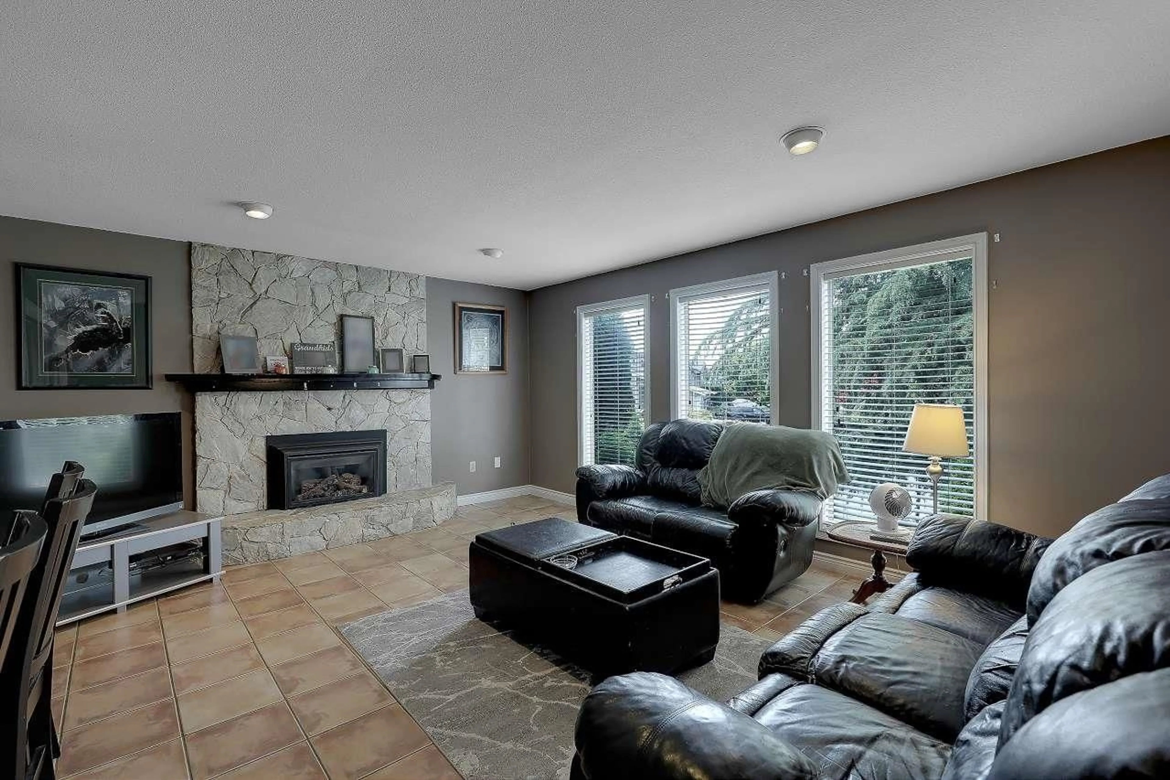 Living room with furniture, ceramic/tile floor for 9230 212B STREET, Langley British Columbia V1M1K9