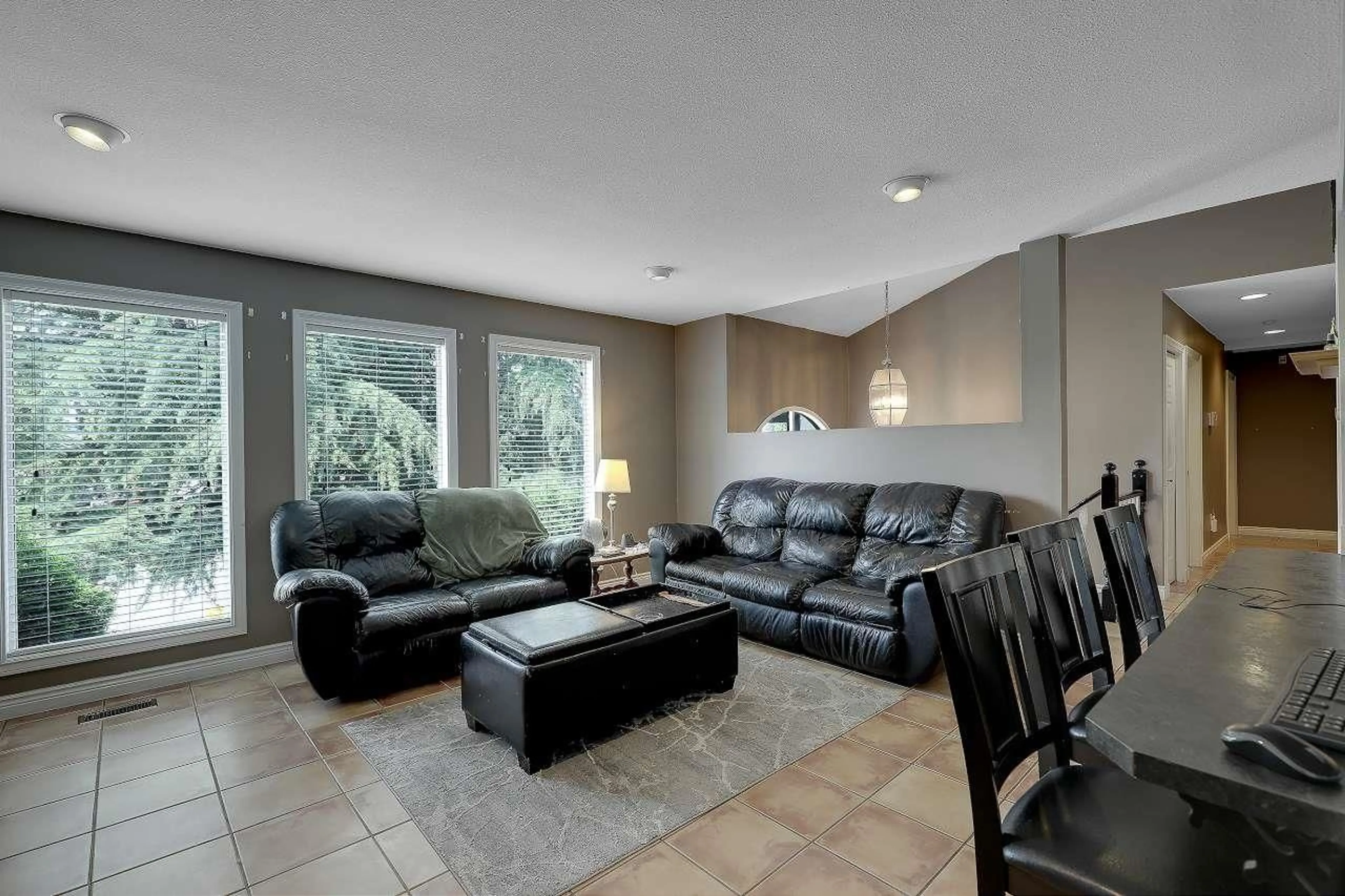 Living room with furniture, ceramic/tile floor for 9230 212B STREET, Langley British Columbia V1M1K9