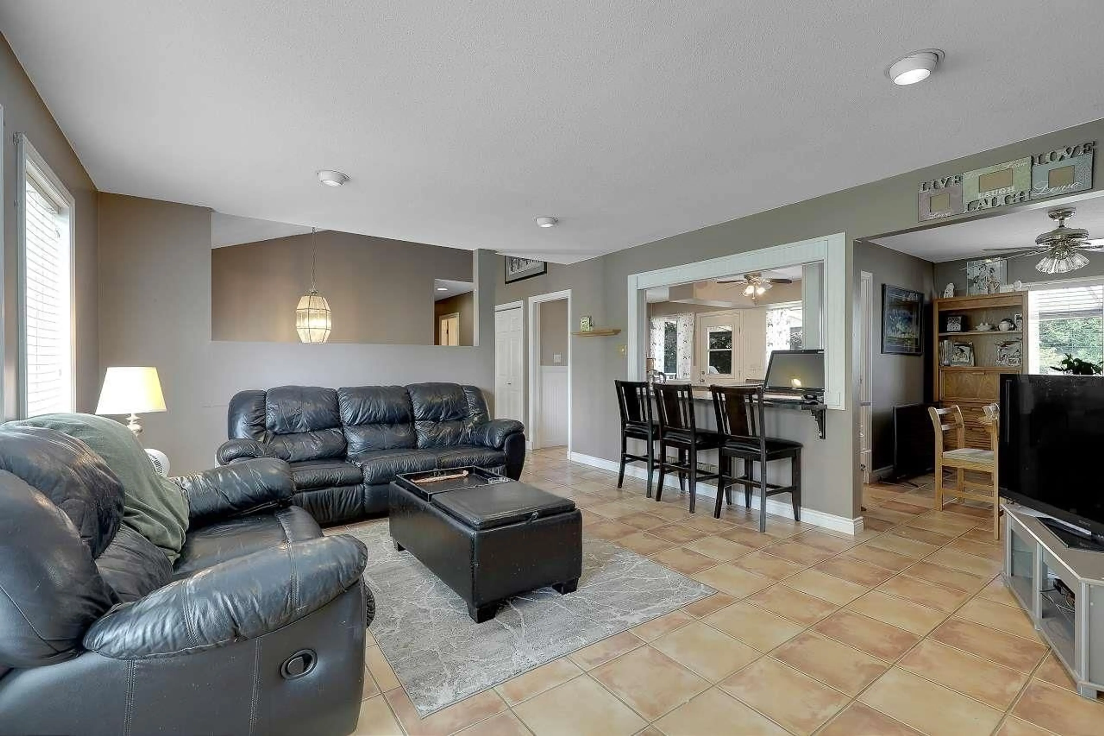 Living room with furniture, ceramic/tile floor for 9230 212B STREET, Langley British Columbia V1M1K9