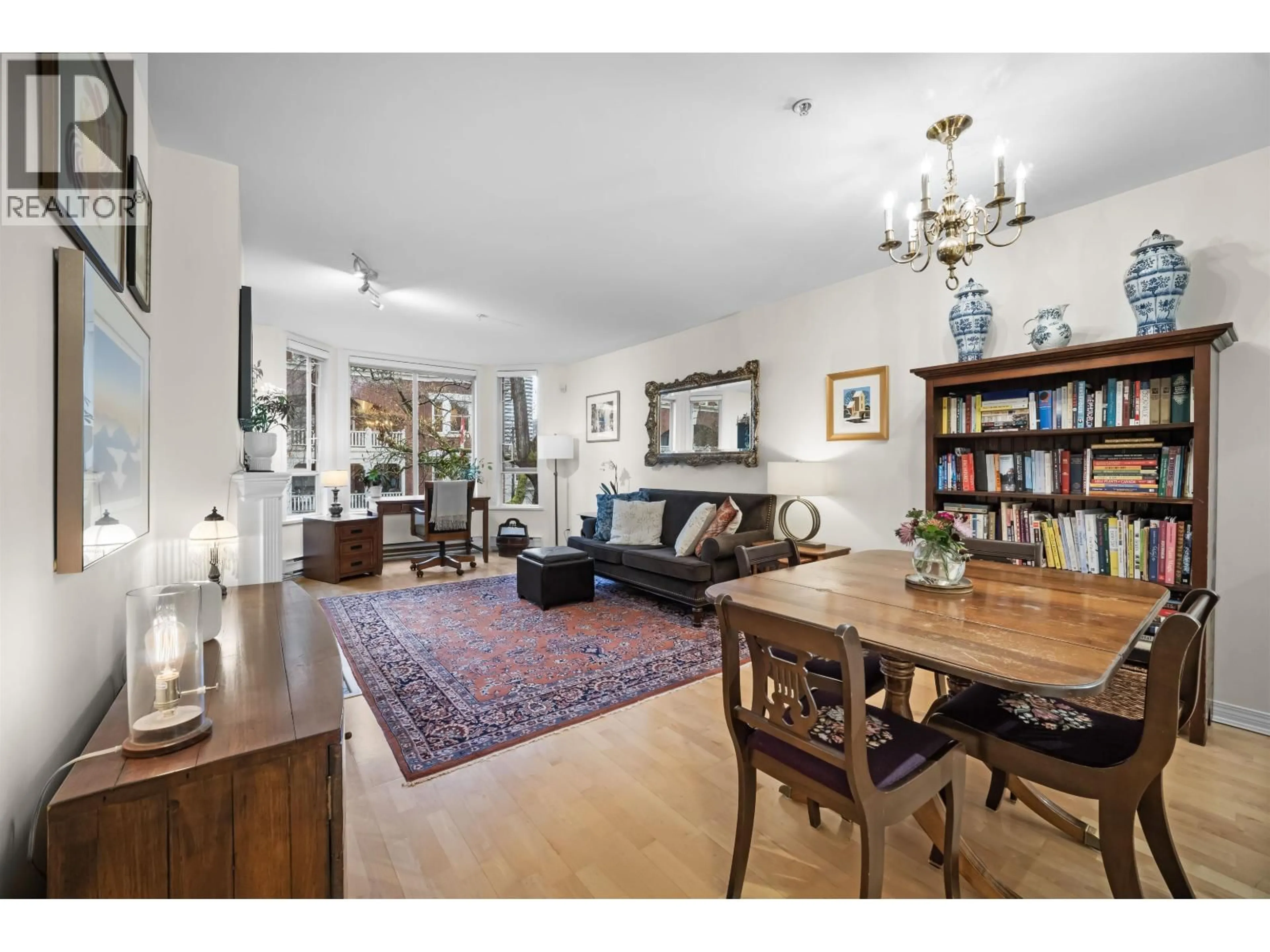 Living room with furniture, wood/laminate floor for 407 - 1230 HARO STREET, Vancouver British Columbia V6E4J9