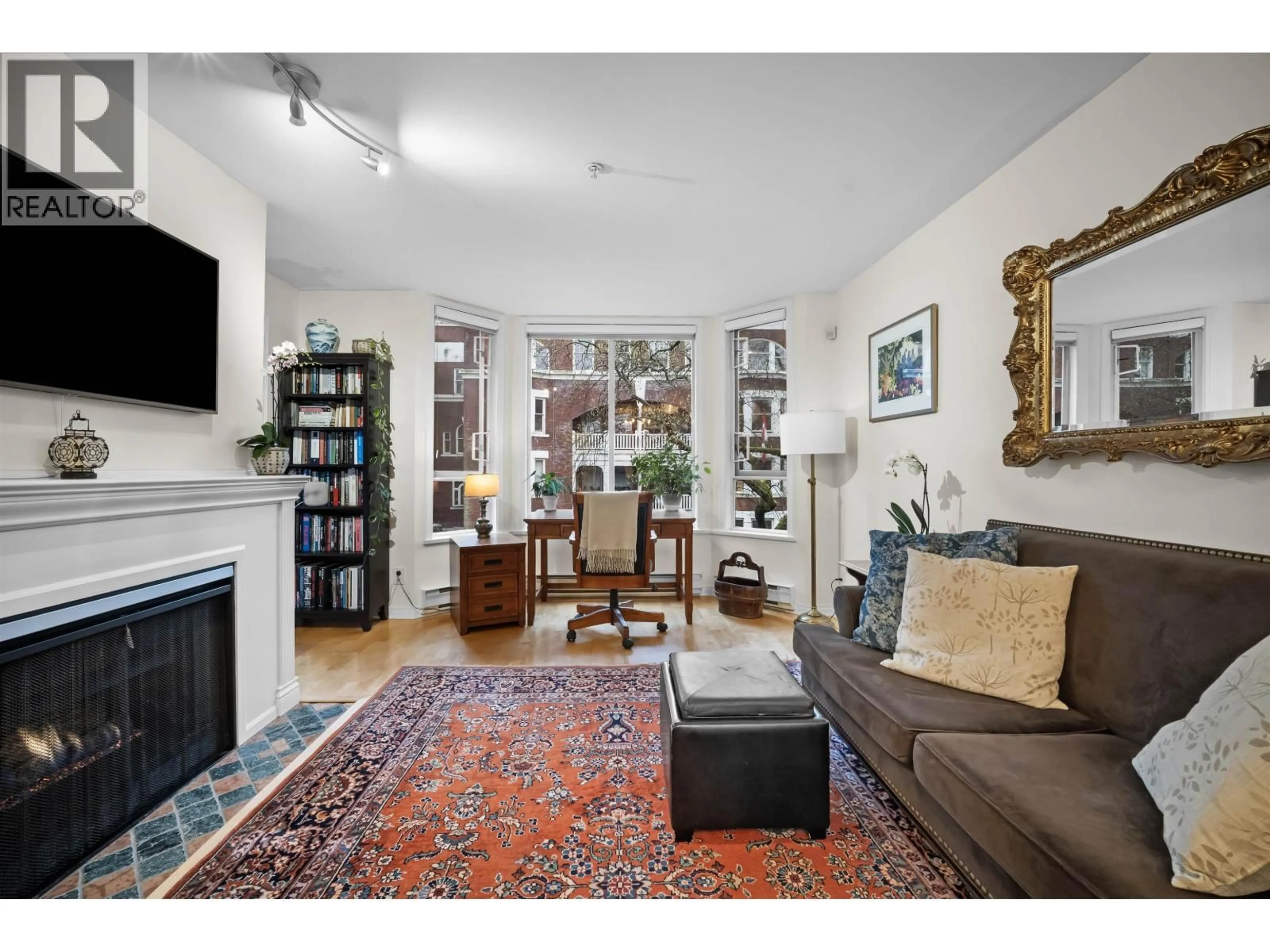 Living room with furniture, carpet floor for 407 - 1230 HARO STREET, Vancouver British Columbia V6E4J9