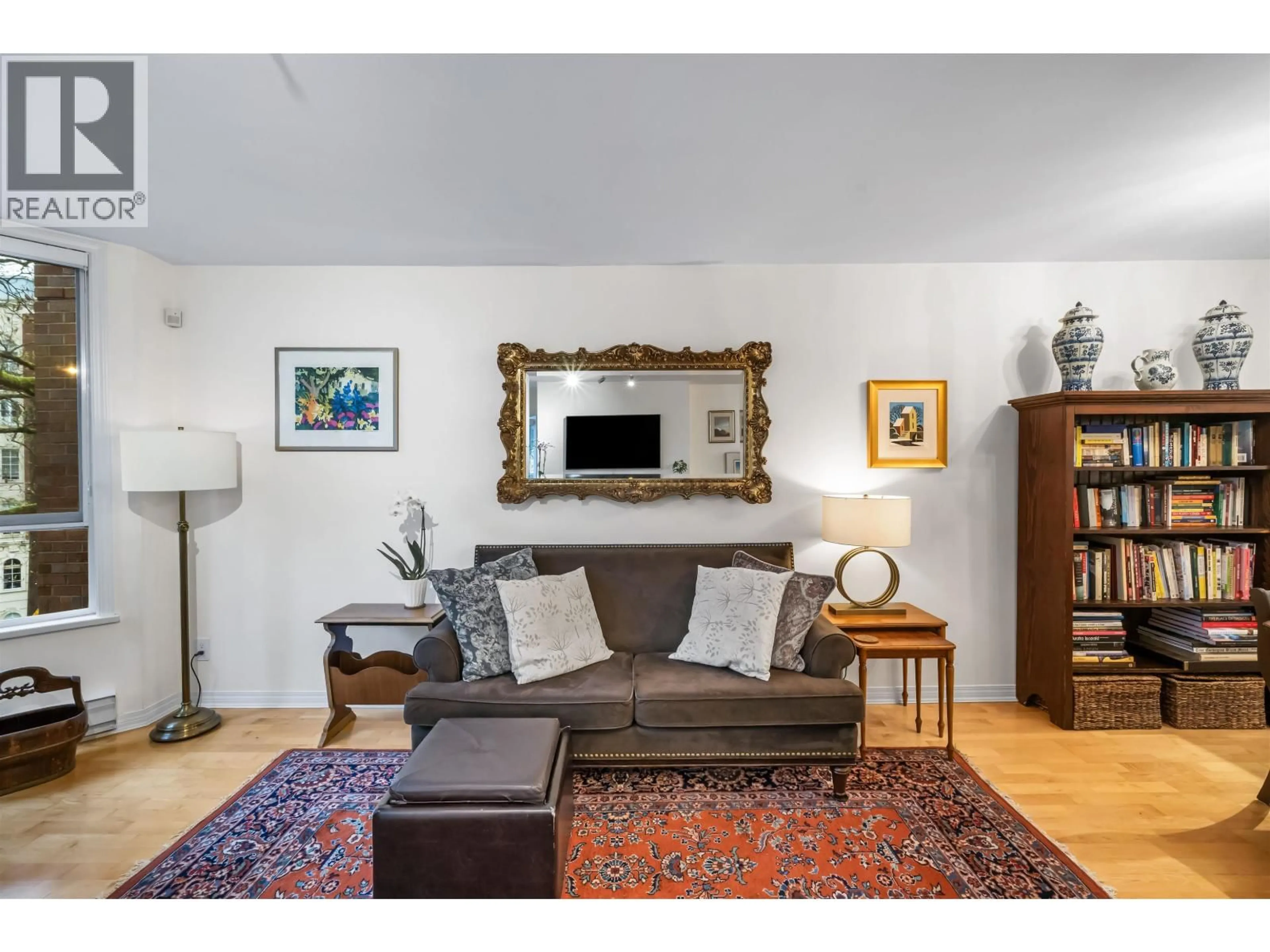 Living room with furniture, wood/laminate floor for 407 - 1230 HARO STREET, Vancouver British Columbia V6E4J9