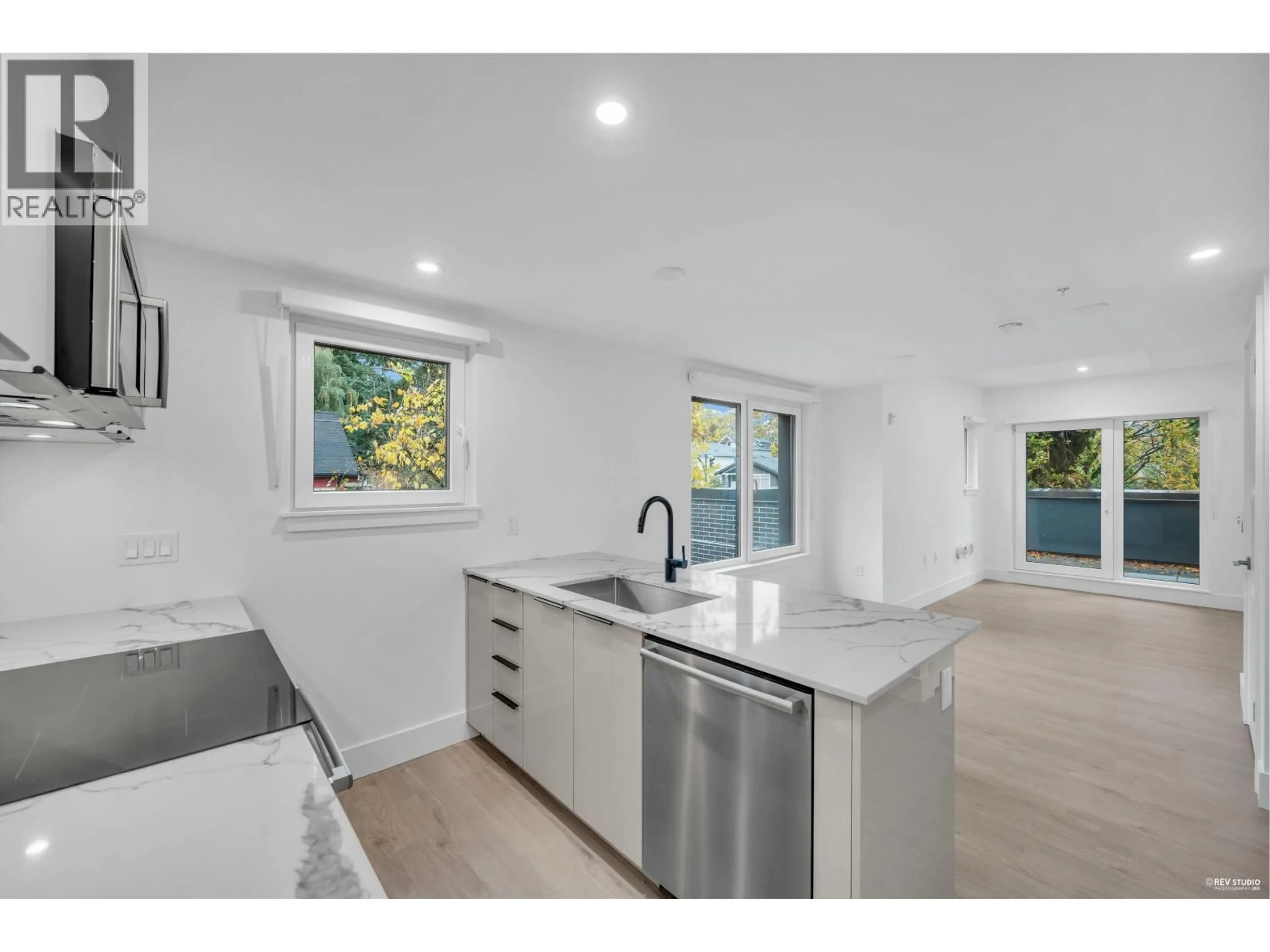 Open concept kitchen, unknown for 108 - 2073 1 AVENUE, Vancouver British Columbia V5N1B6