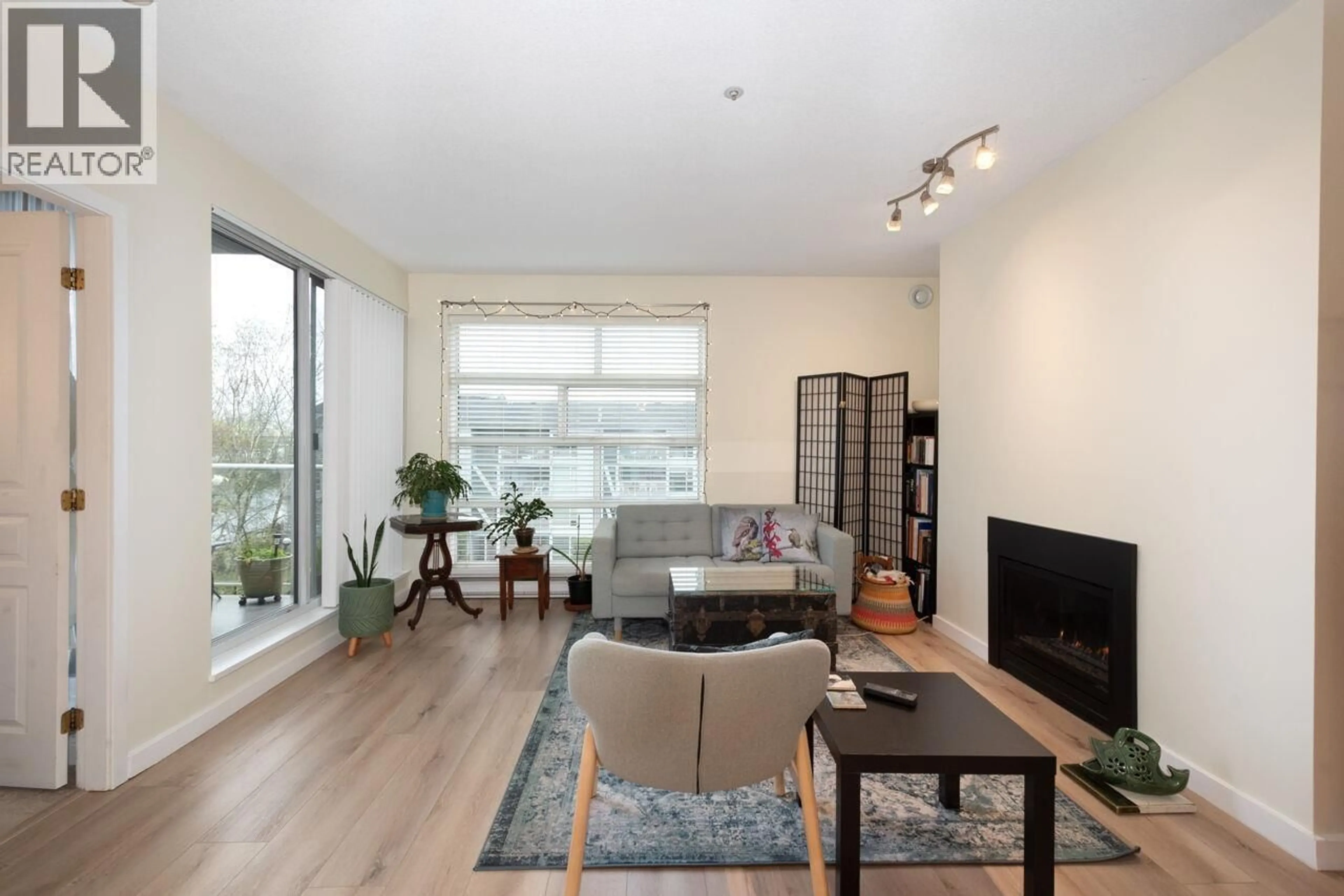 Living room with furniture, wood/laminate floor for 402 - 2080 KENT AVENUE SOUTH, Vancouver British Columbia V5P4X2