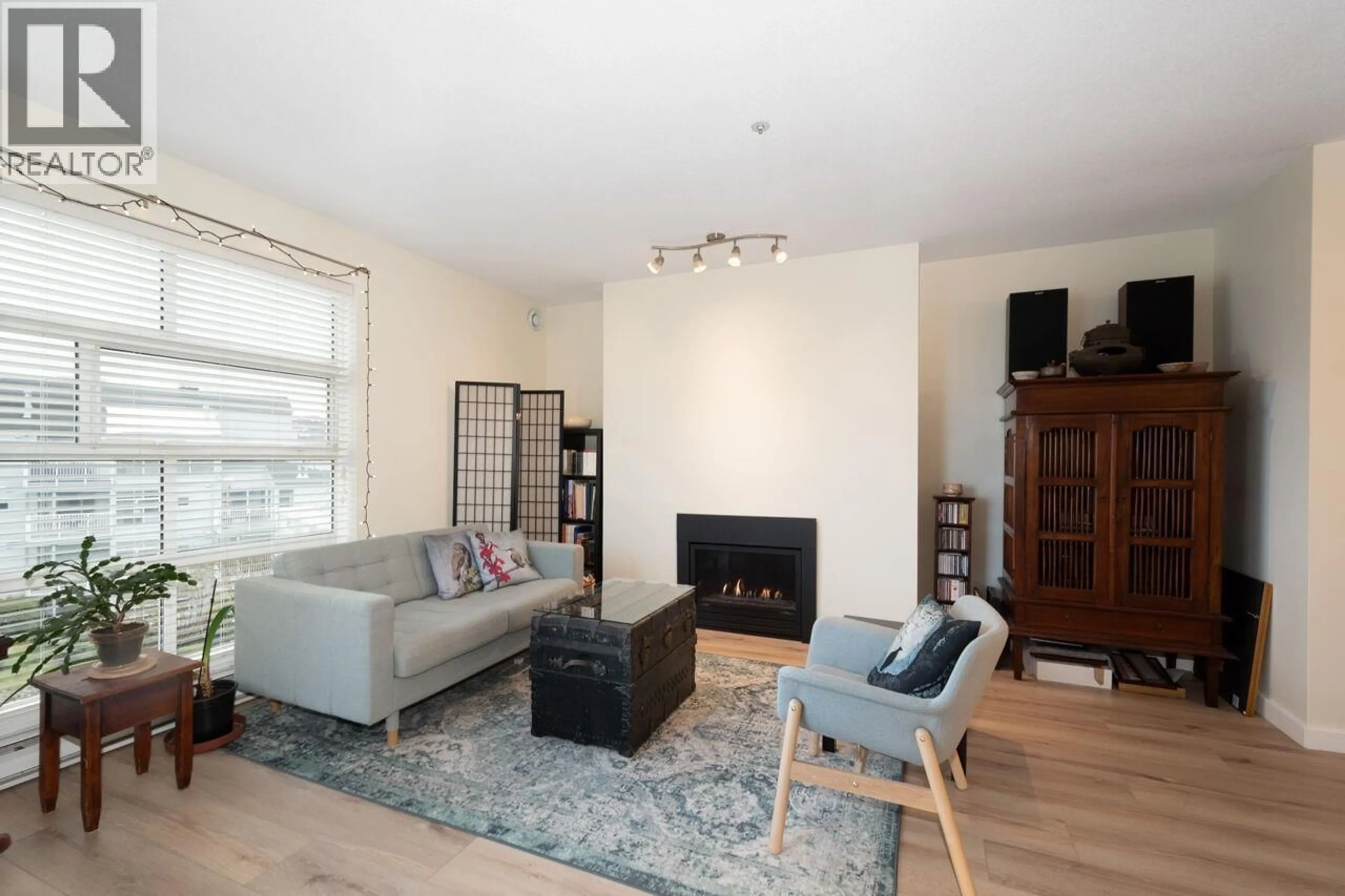 Living room with furniture, wood/laminate floor for 402 - 2080 KENT AVENUE SOUTH, Vancouver British Columbia V5P4X2