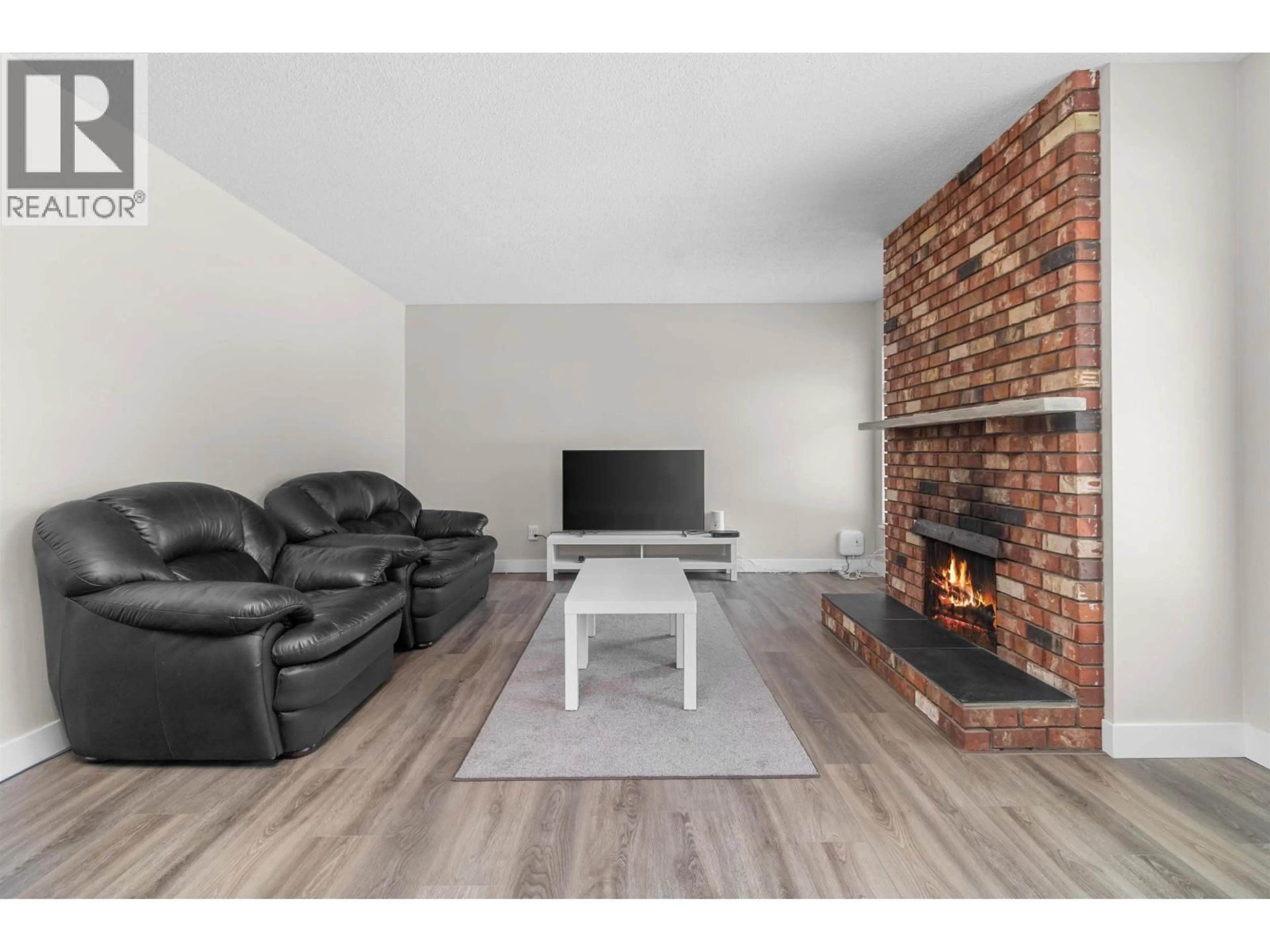 Living room with furniture, wood/laminate floor for 1204 NESTOR STREET, Coquitlam British Columbia V3E1H6