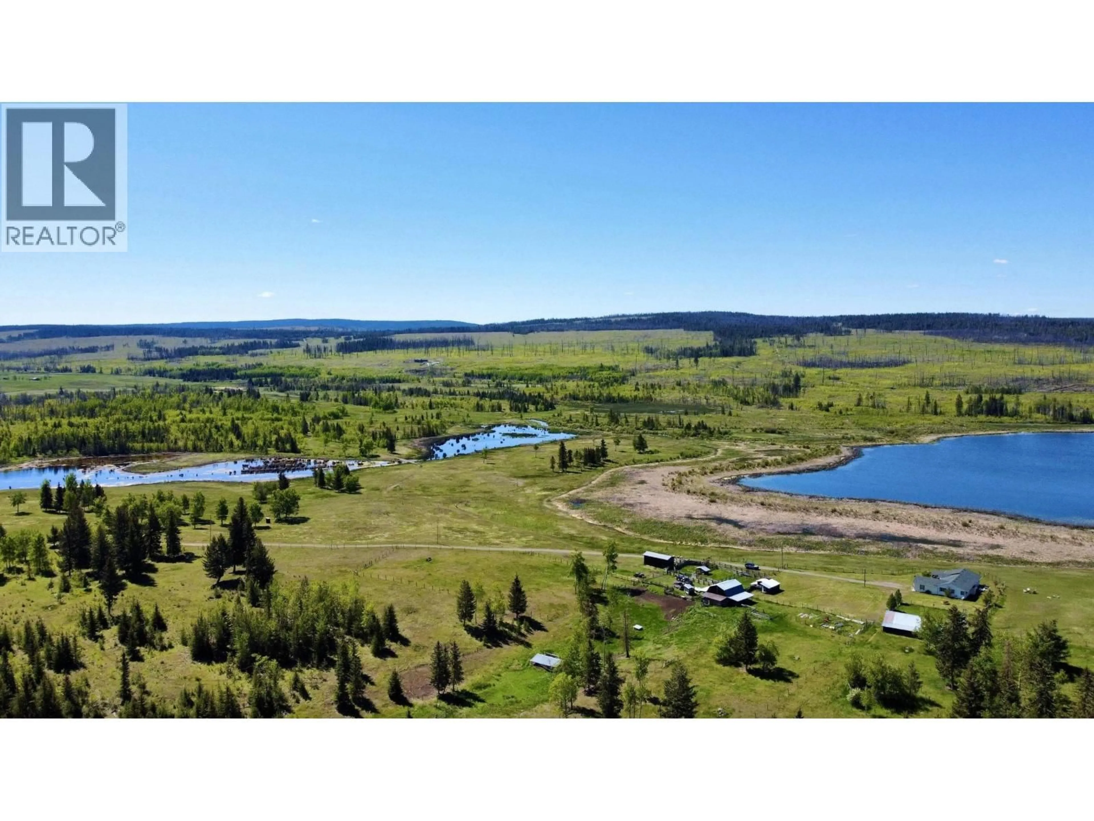 A pic from outside/outdoor area/front of a property/back of a property/a pic from drone, water/lake/river/ocean view for 5028 ABEL LAKE ROAD, 100 Mile House British Columbia V0K2E1