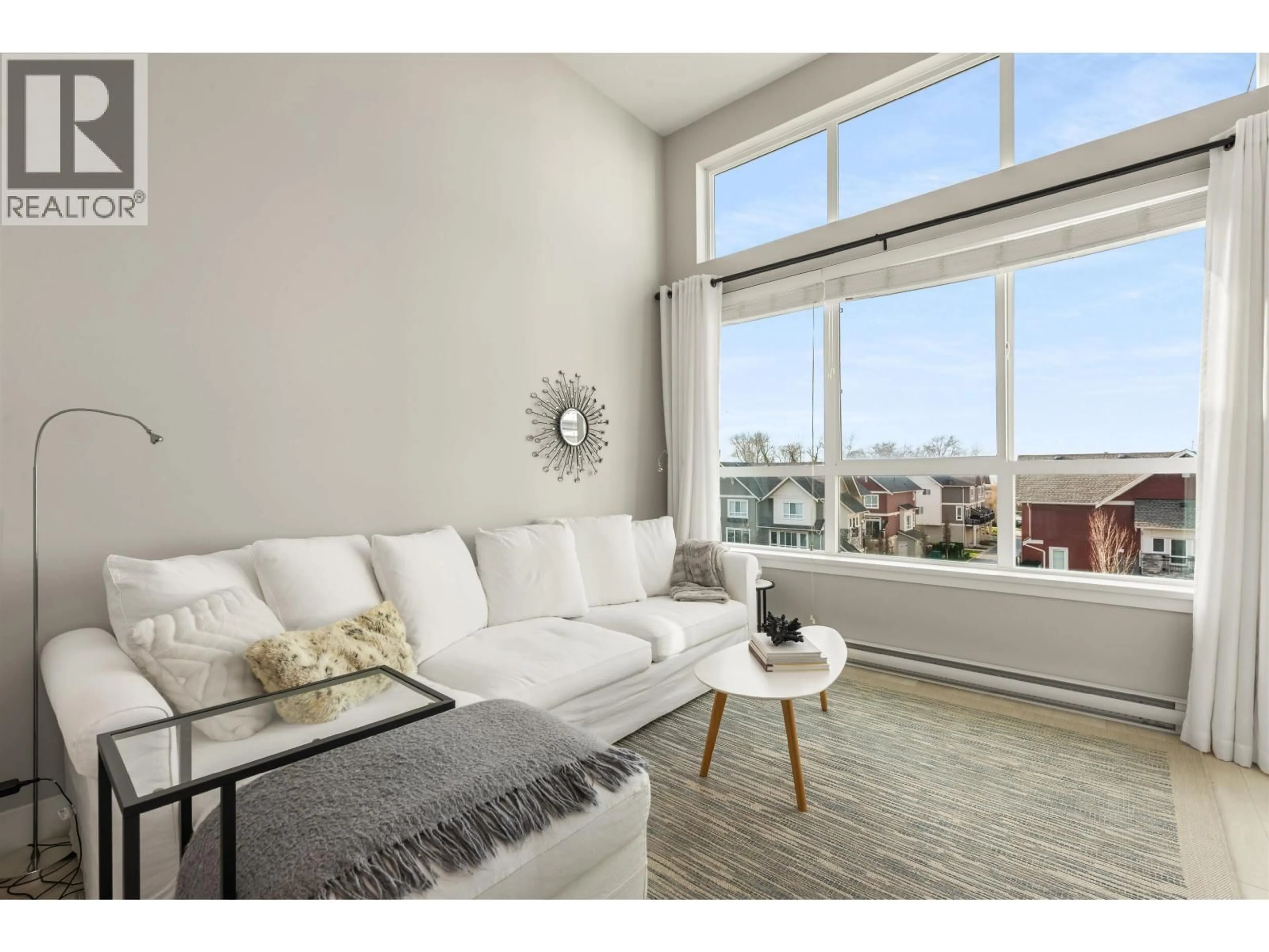 Living room with furniture, wood/laminate floor for 408 - 4690 HAWK LANE, Tsawwassen British Columbia V4M0C4