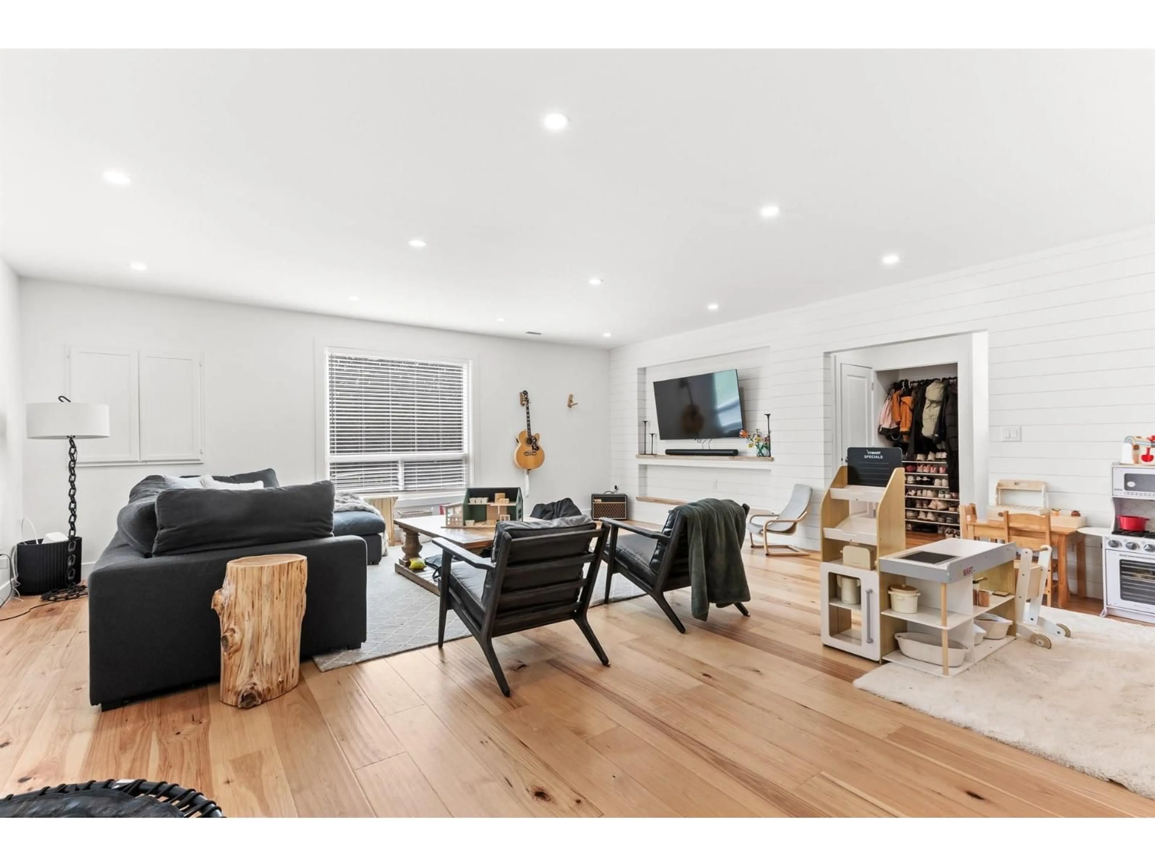 Living room with furniture, wood/laminate floor for 7025 HESSLEA CRESCENT, Abbotsford British Columbia V4X2C2