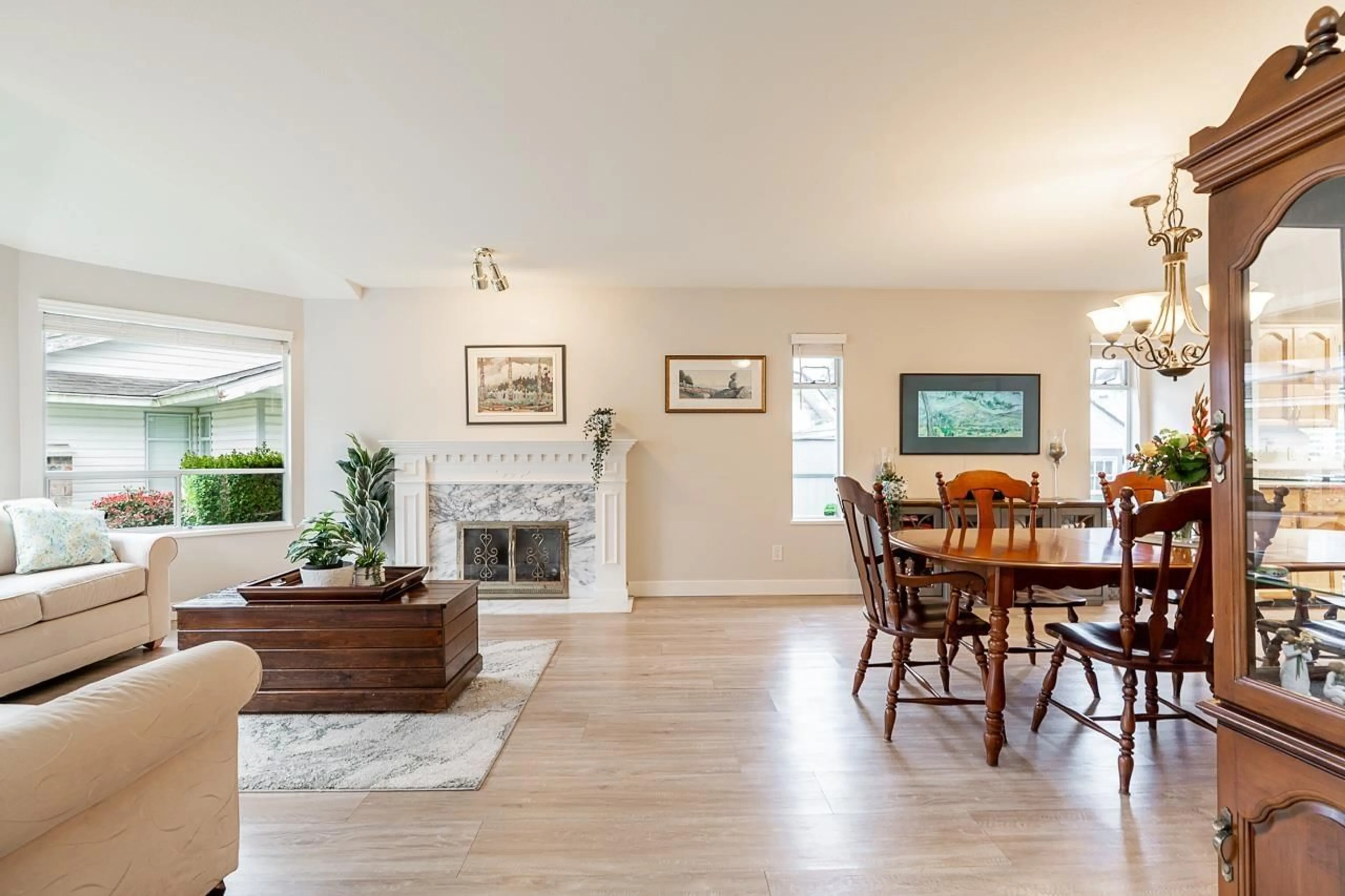Living room with furniture, wood/laminate floor for 14035 16B AVENUE, Surrey British Columbia V4A8K3