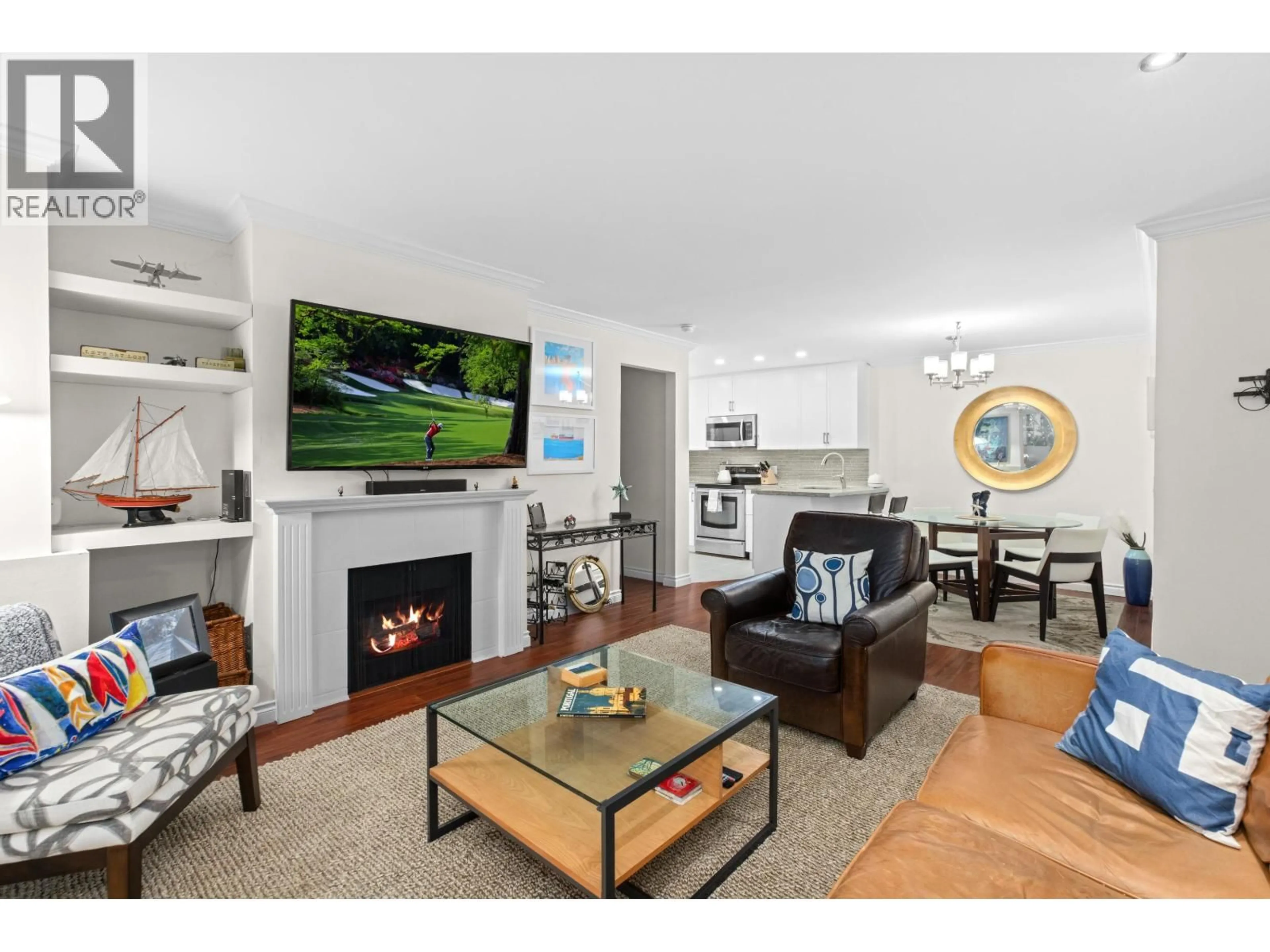 Living room with furniture, wood/laminate floor for 105 - 1125 GILFORD STREET, Vancouver British Columbia V6G2P7