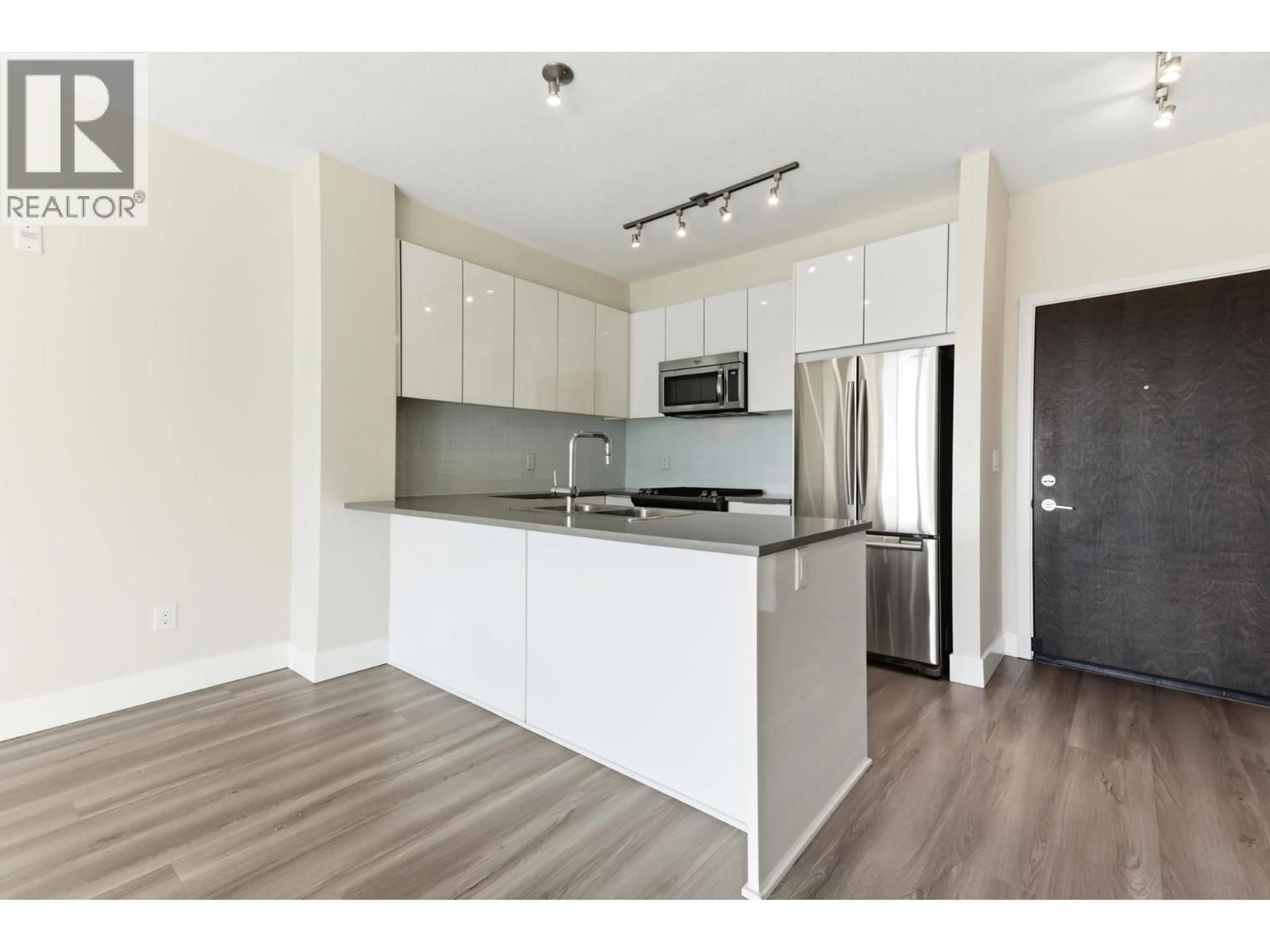 Open concept kitchen, wood/laminate floor for 505 - 1152 WINDSOR MEWS, Coquitlam British Columbia V3B0N1