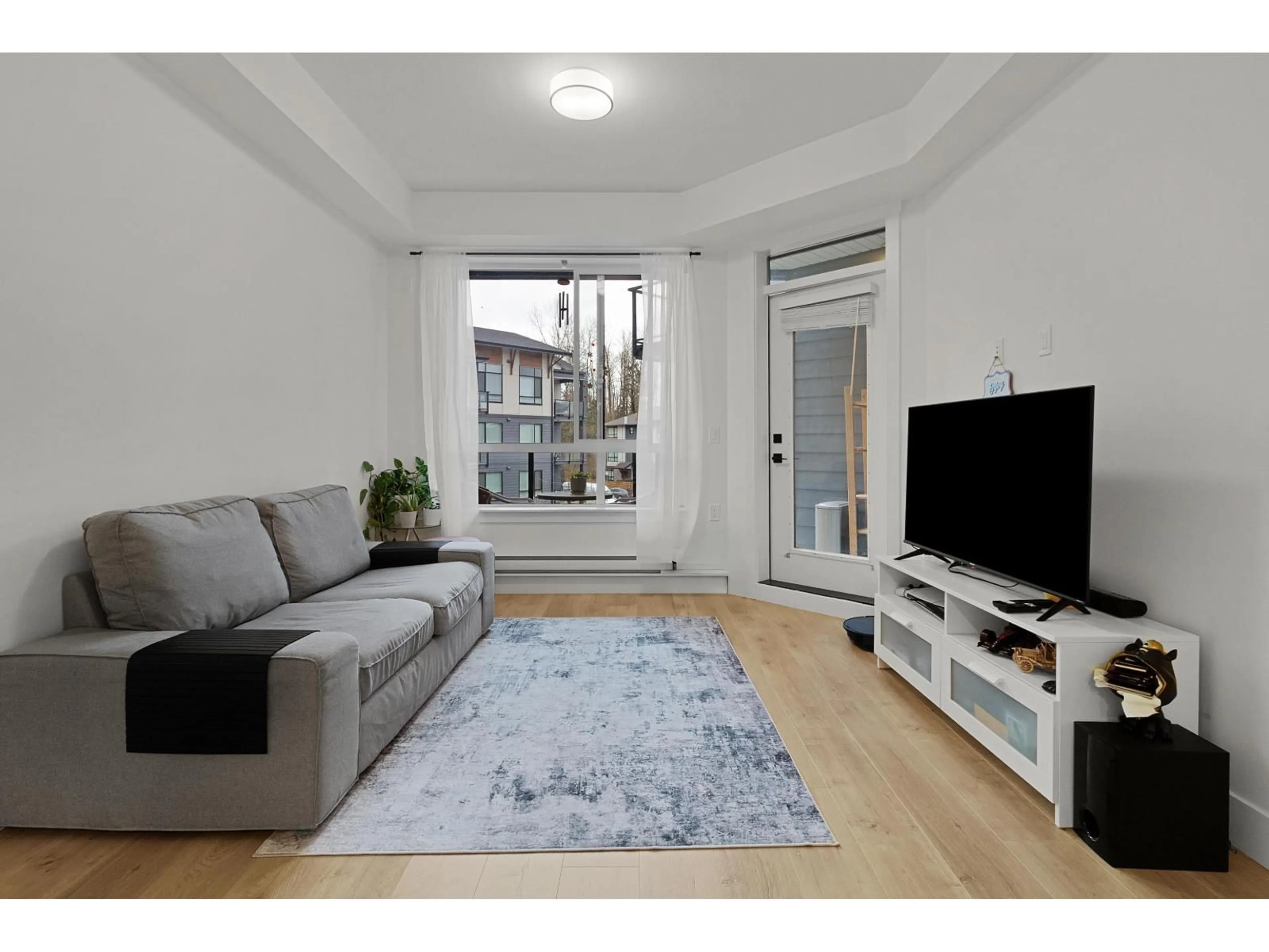 Living room with furniture, unknown for 327 - 7506 199A STREET, Langley British Columbia V2Y3K9