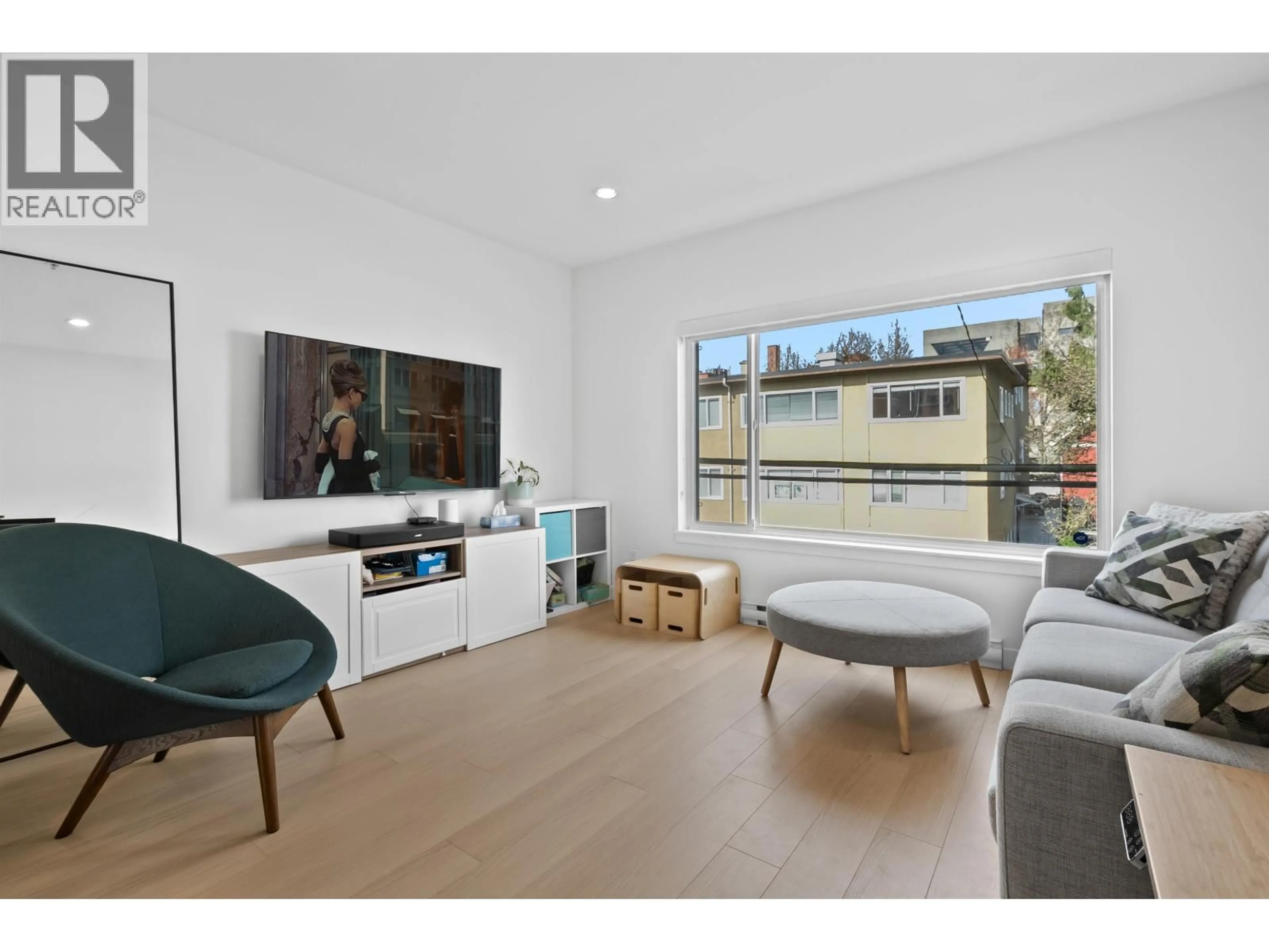 Living room with furniture, wood/laminate floor for 216 - 455 16TH AVENUE, Vancouver British Columbia V5T2T8