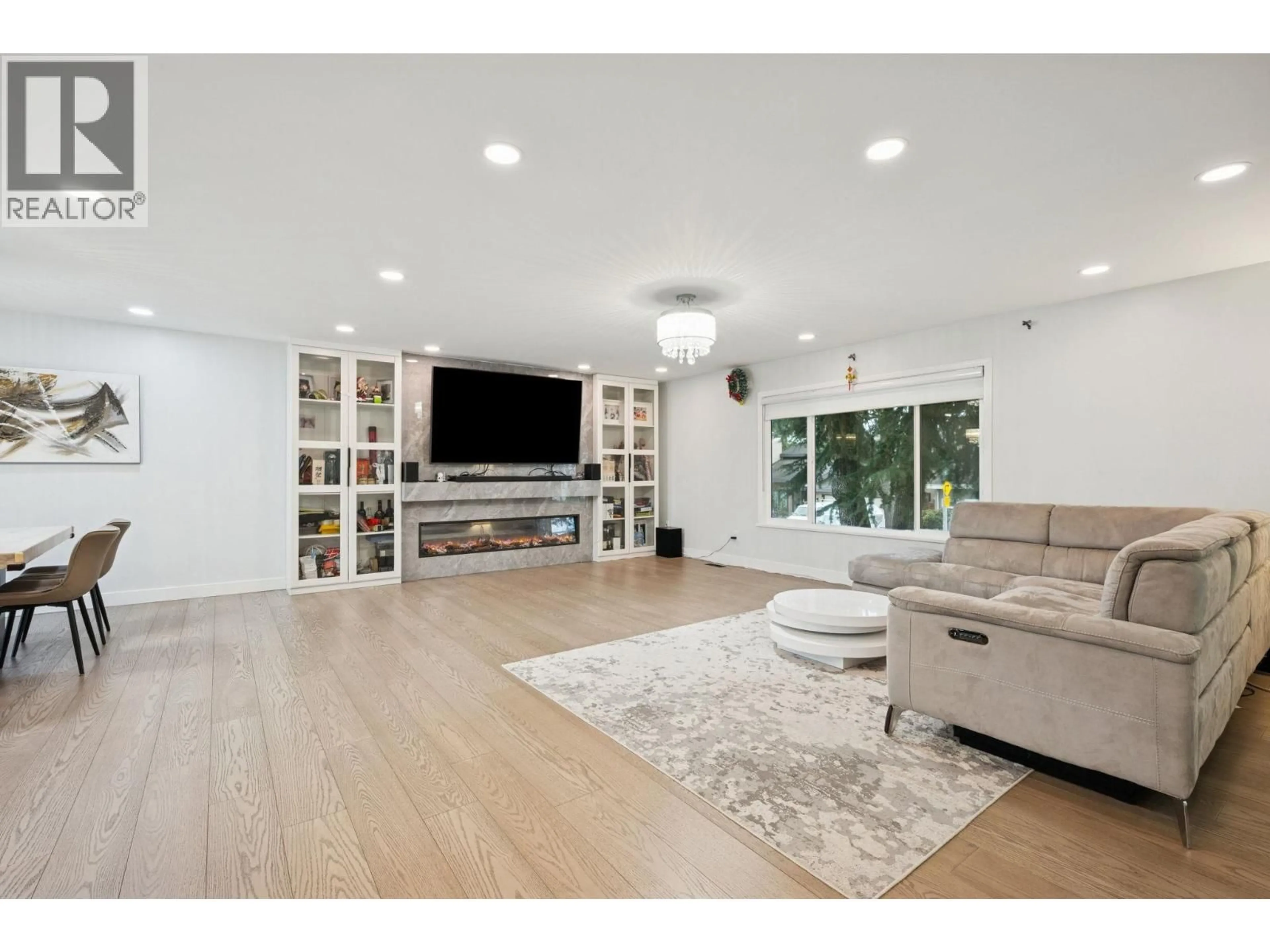 Living room with furniture, wood/laminate floor for 4811 LANCELOT DRIVE, Richmond British Columbia V7C4S4