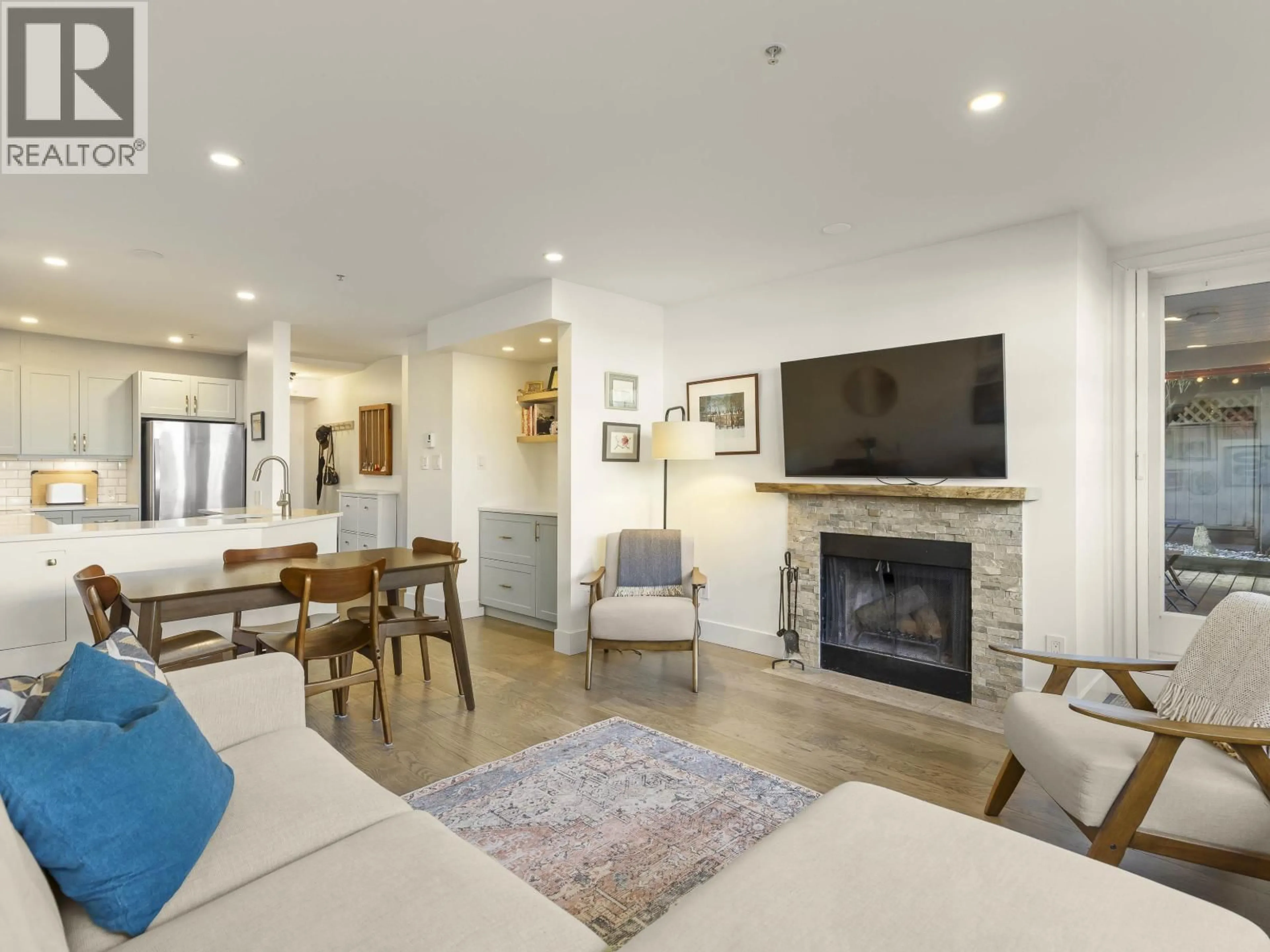 Living room with furniture, wood/laminate floor for 102 - 2287 3RD AVENUE, Vancouver British Columbia V6K1L5