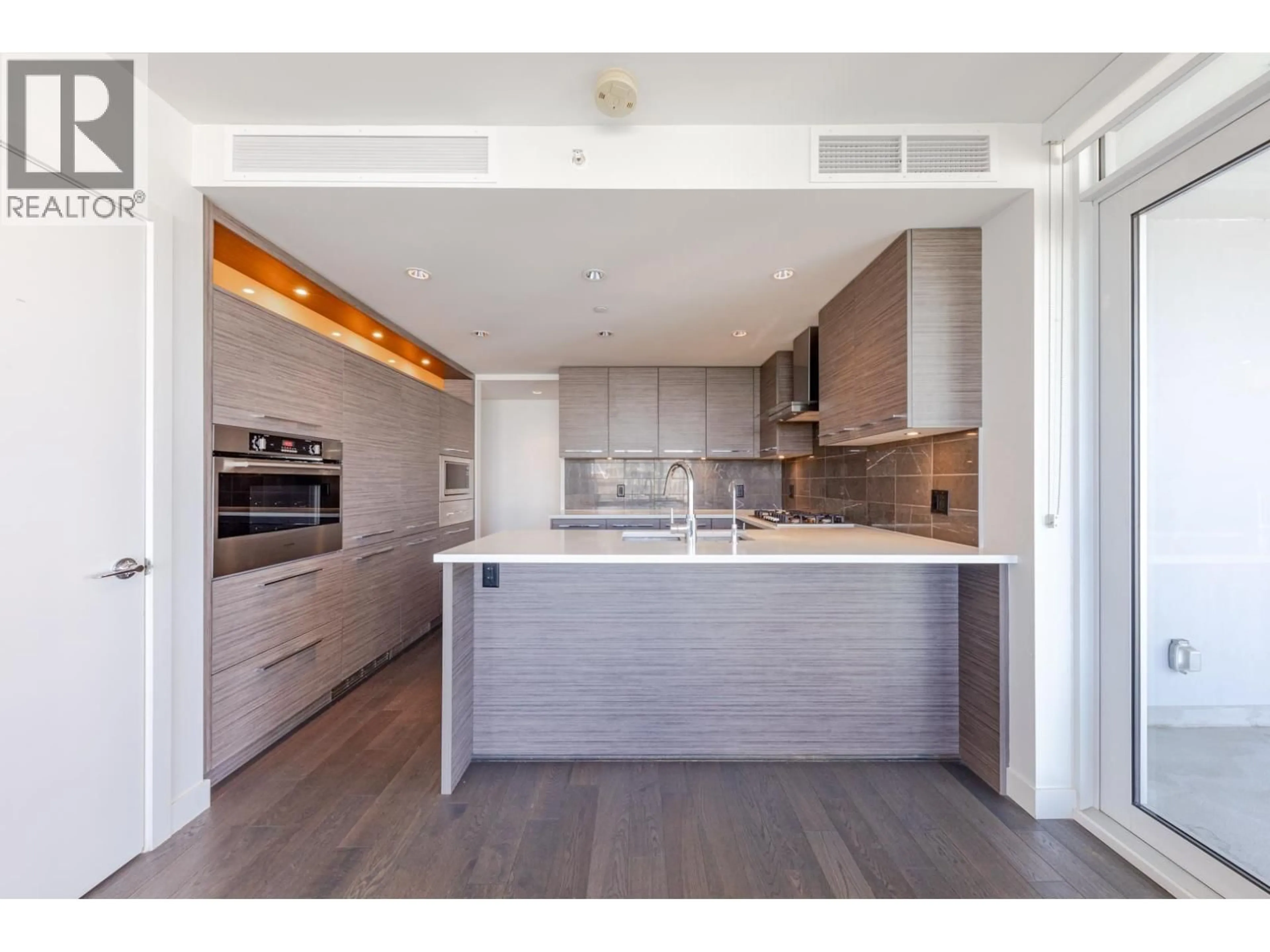 Open concept kitchen, wood/laminate floor for 902 - 7468 LANSDOWNE ROAD, Richmond British Columbia V7C0B7