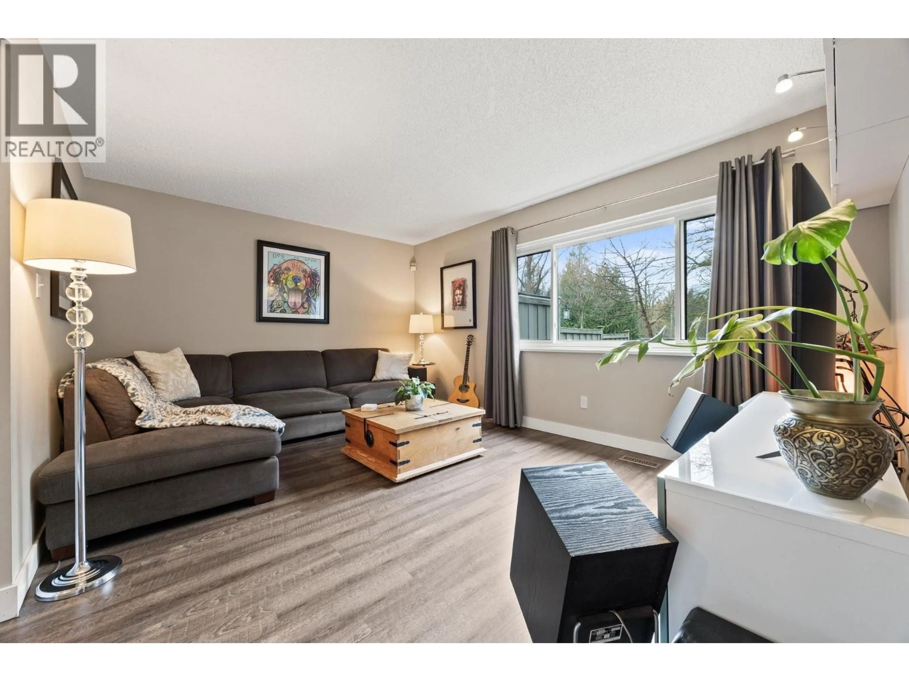 Living room with furniture, wood/laminate floor for 63 - 2905 NORMAN AVENUE, Coquitlam British Columbia V3C4H8