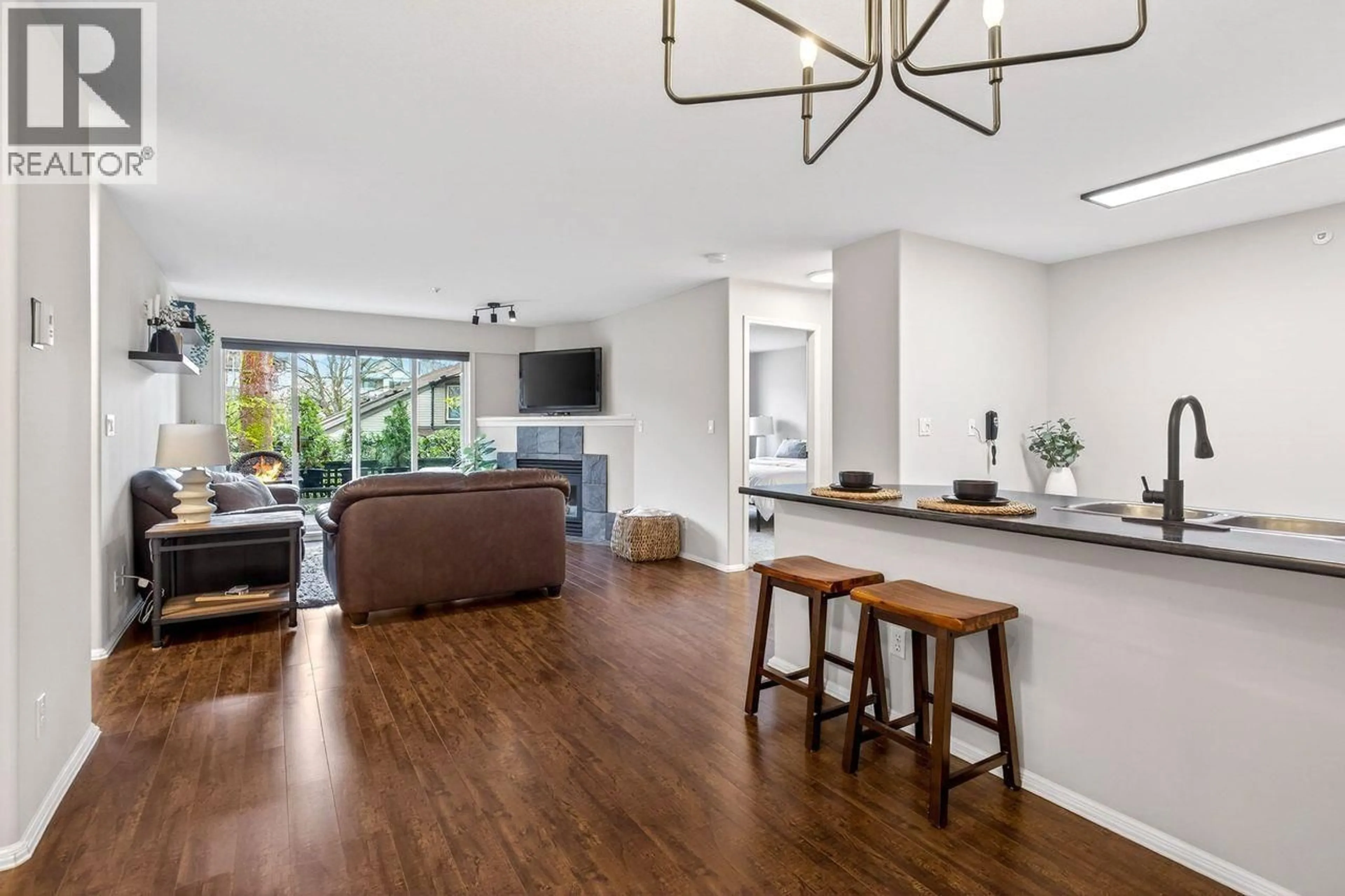 Open concept kitchen, wood/laminate floor for 104 - 11960 HARRIS ROAD, Pitt Meadows British Columbia V3Y2R1