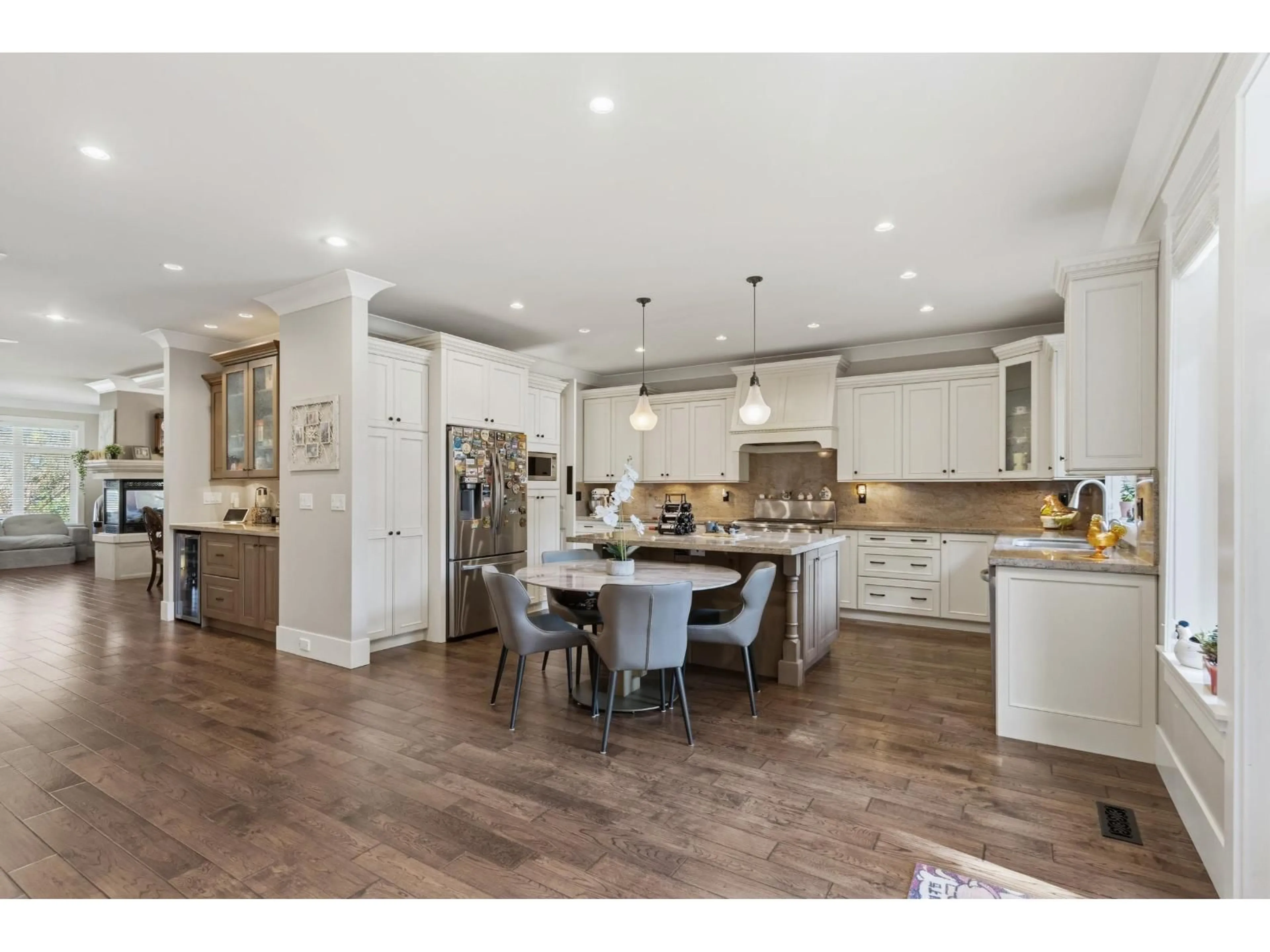 Open concept kitchen, wood/laminate floor for 12576 26A AVENUE, Surrey British Columbia V4A2M2