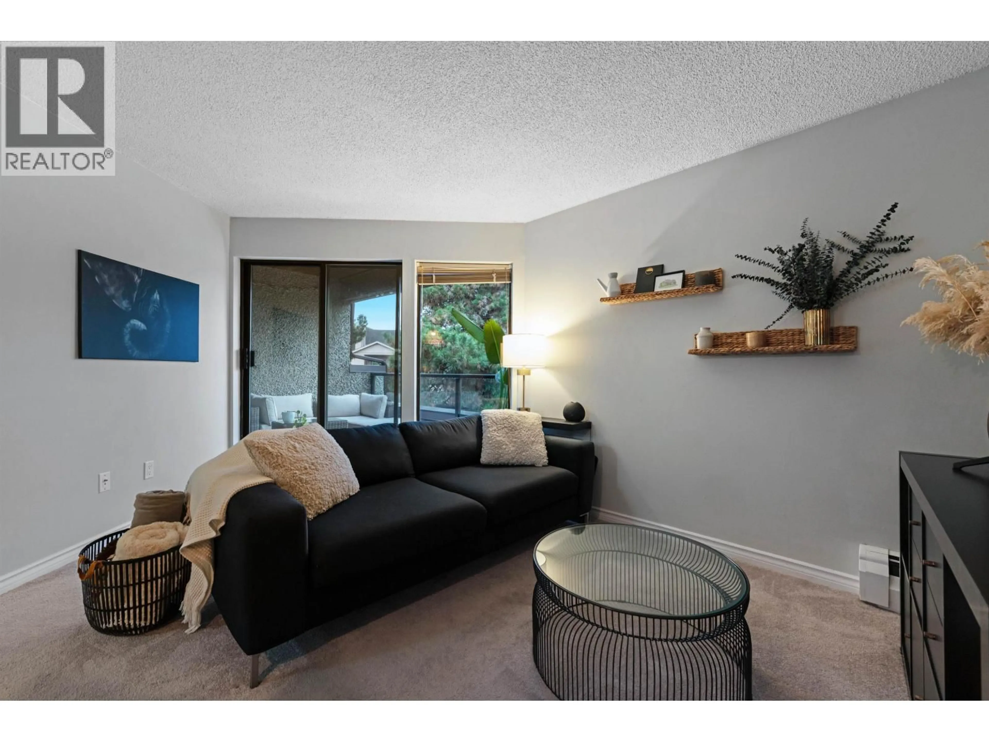 Living room with furniture, wood/laminate floor for 327 - 8460 ACKROYD ROAD, Richmond British Columbia V6X3E9