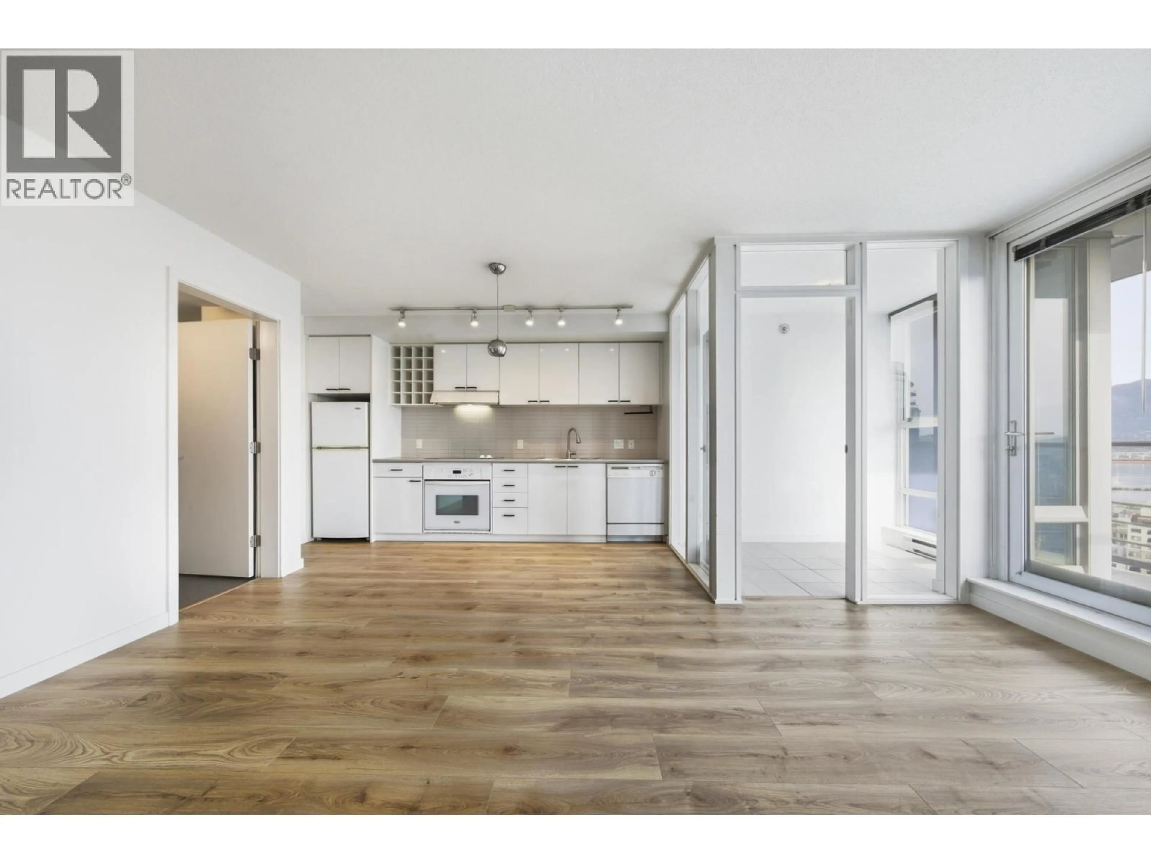 Open concept kitchen, wood/laminate floor for 2607 - 602 CITADEL PARADE, Vancouver British Columbia V6B1X2