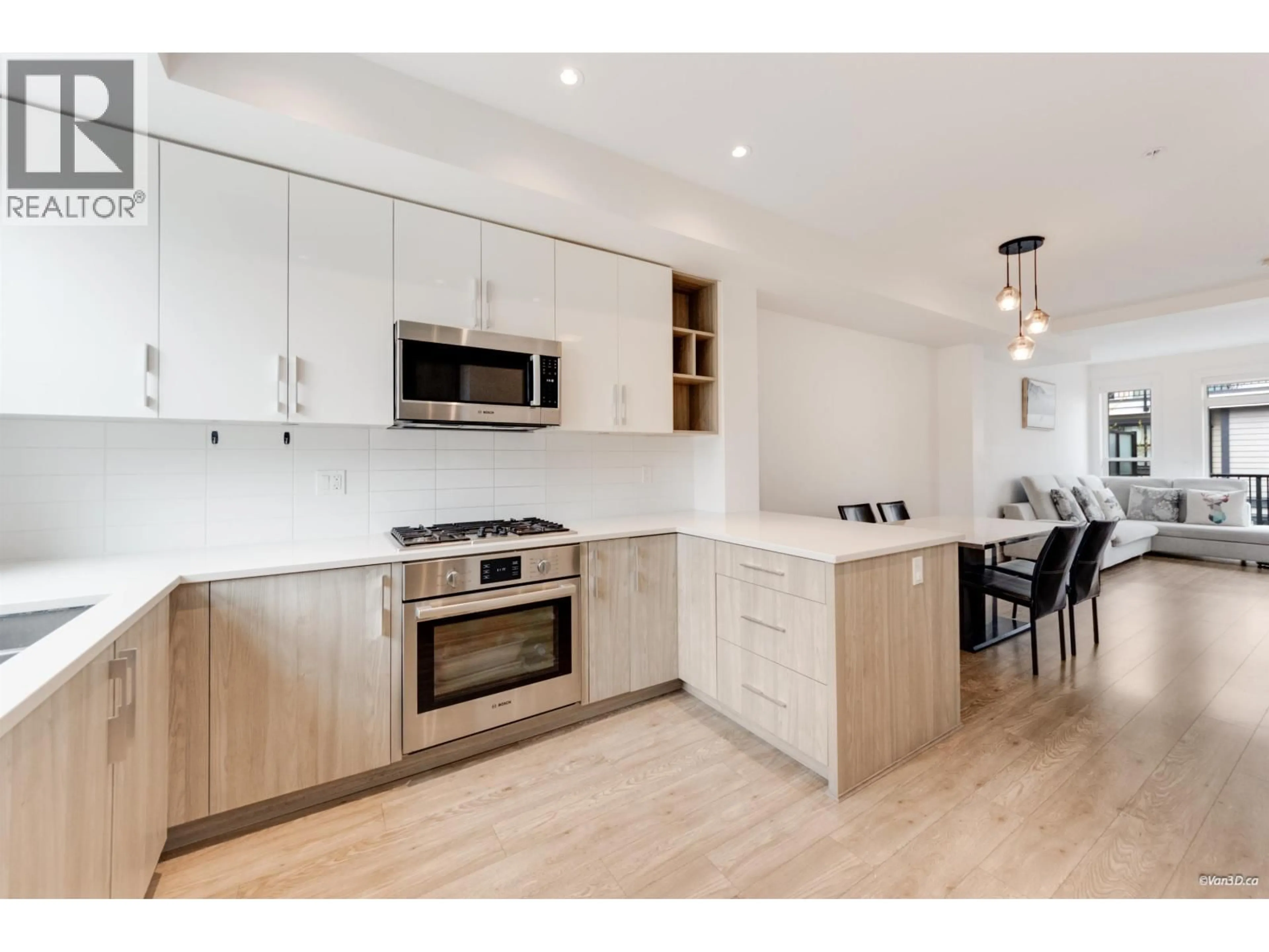 Open concept kitchen, wood/laminate floor for 22 - 7039 MACPHERSON AVENUE, Burnaby British Columbia V5J4N4