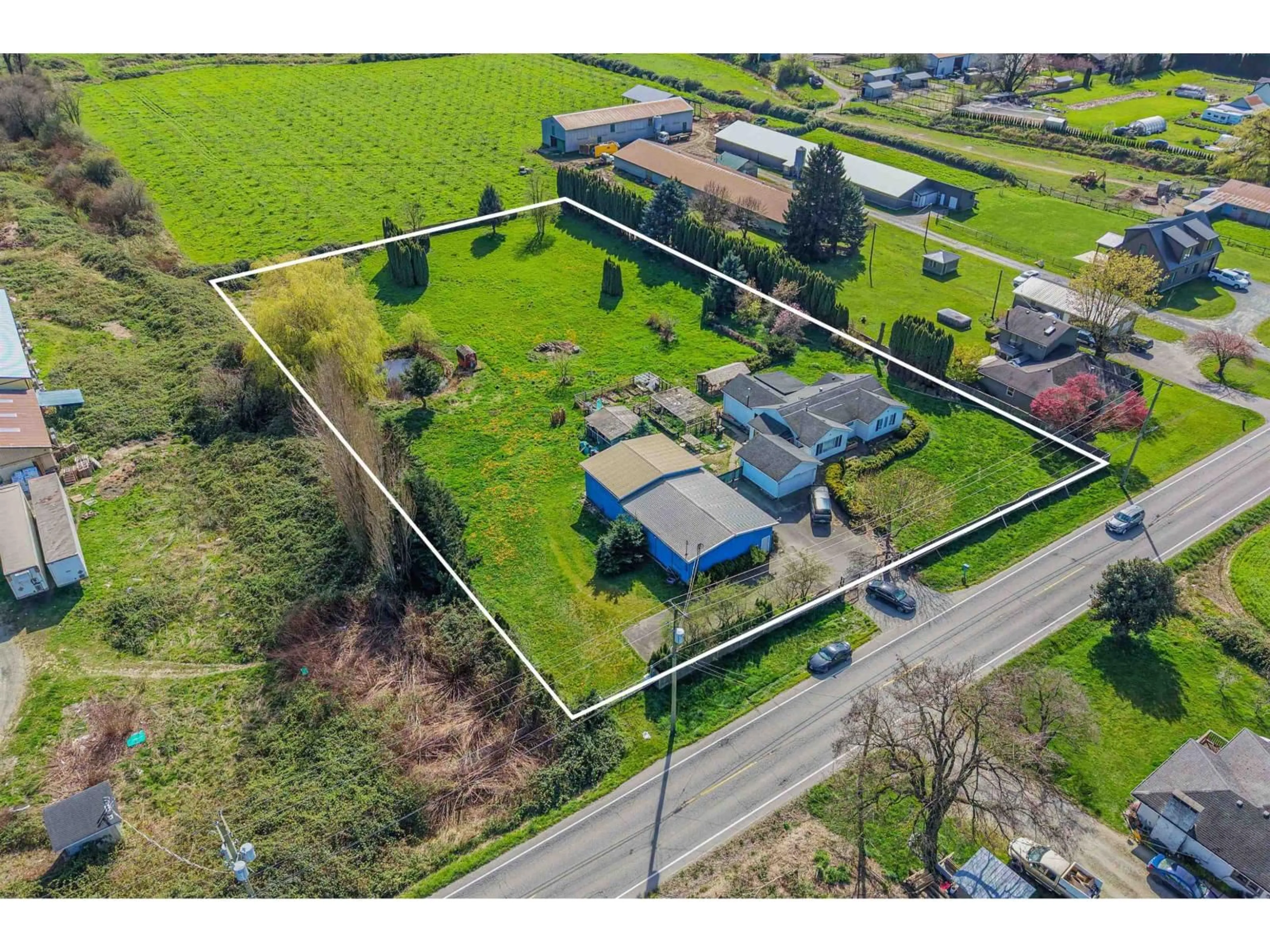 A pic from outside/outdoor area/front of a property/back of a property/a pic from drone, street for 42148 KEITH WILSON ROAD, Sardis - Greendale British Columbia V2R4B2