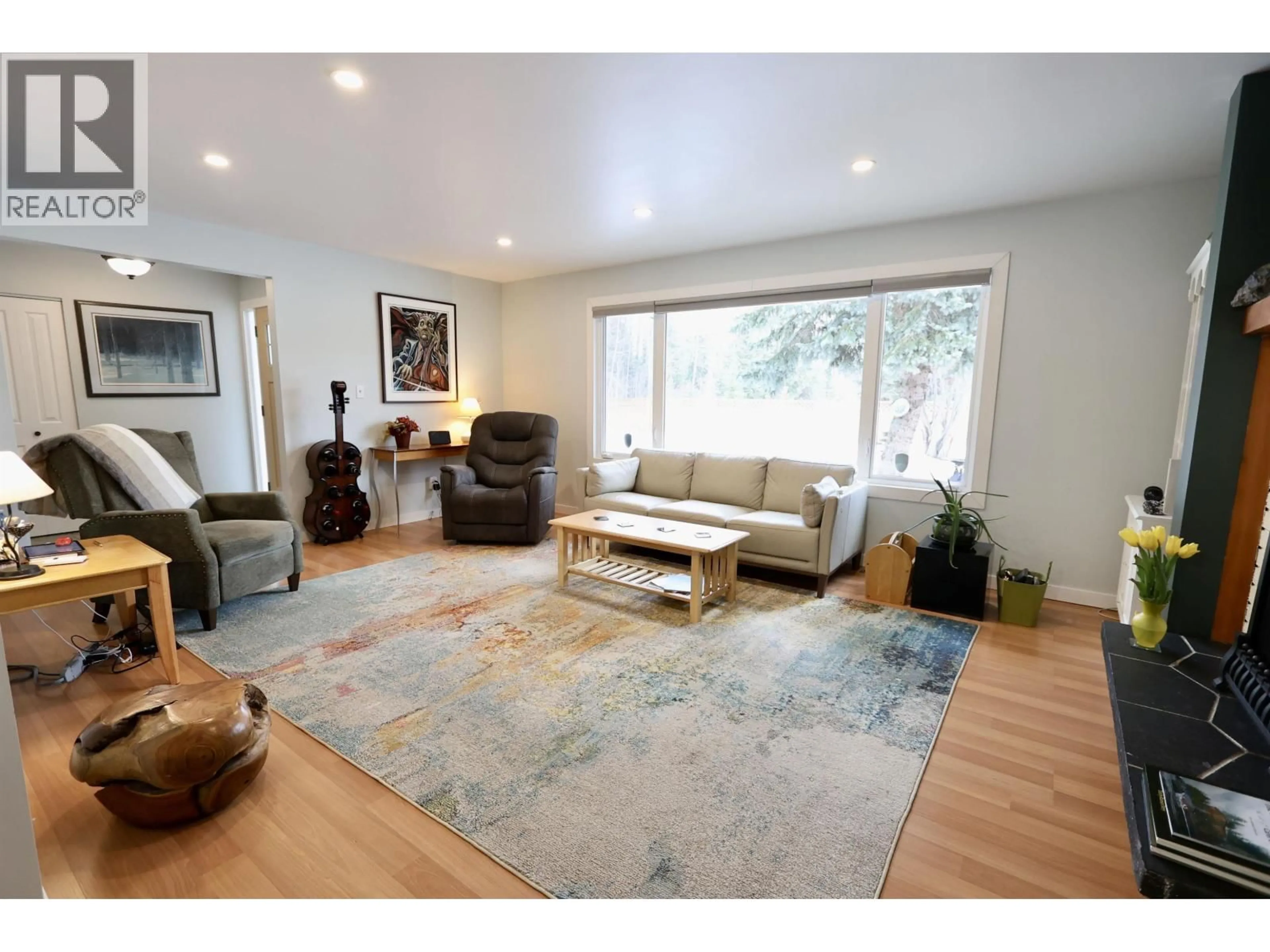 Living room with furniture, wood/laminate floor for 4295 MARLIN ROAD, Prince George British Columbia V2K5W1
