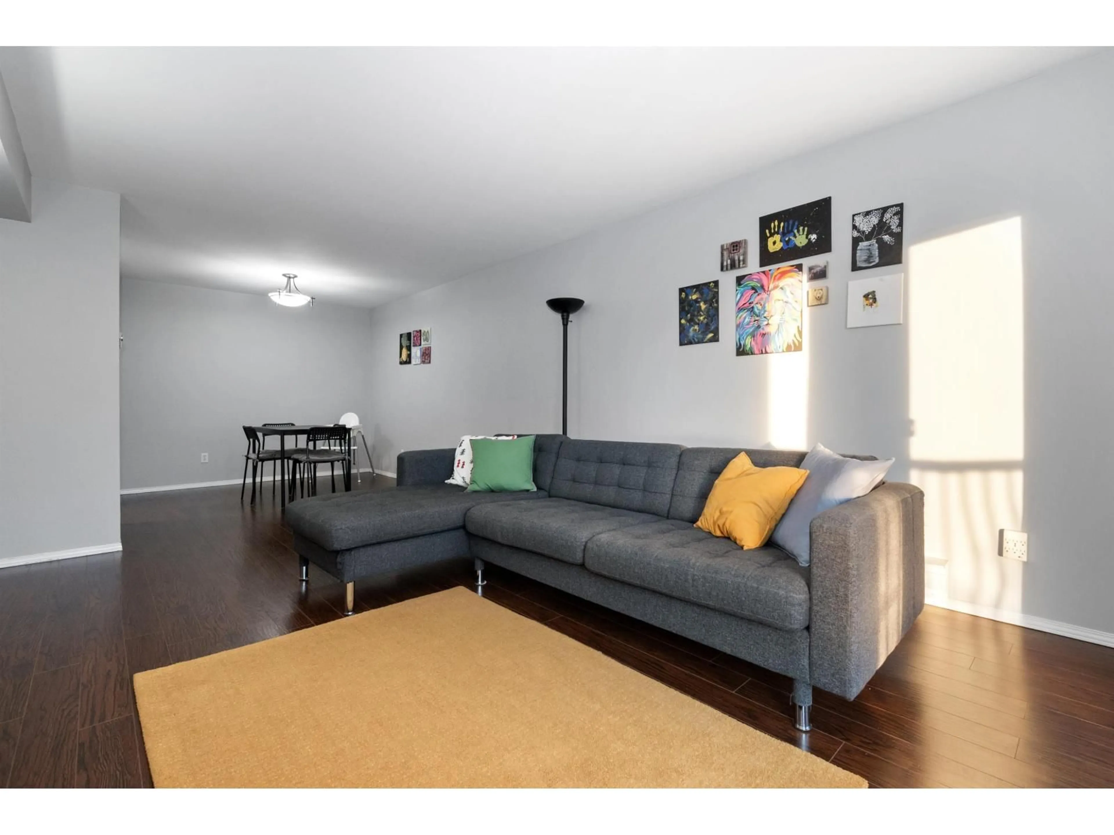 Living room with furniture, wood/laminate floor for 208 - 45222 WATSON ROAD, Chilliwack British Columbia V2R3J4