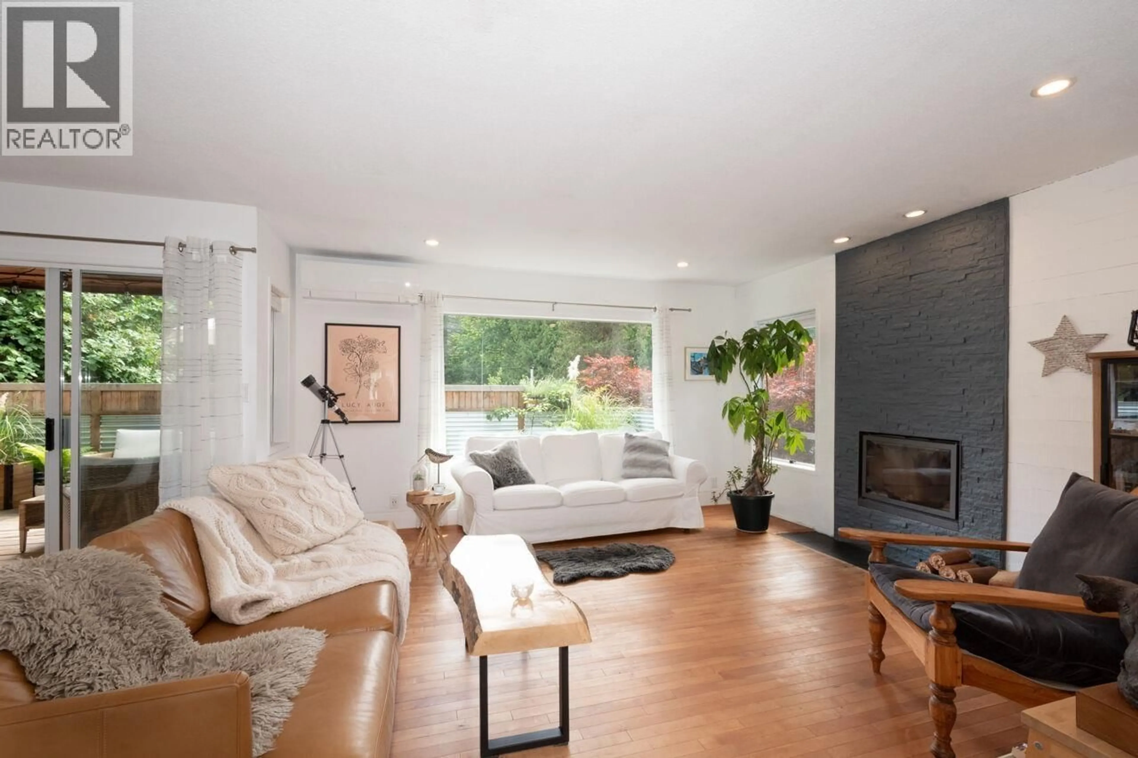 Living room with furniture, wood/laminate floor for 1101 LENORA ROAD, Bowen Island British Columbia V0N1G1