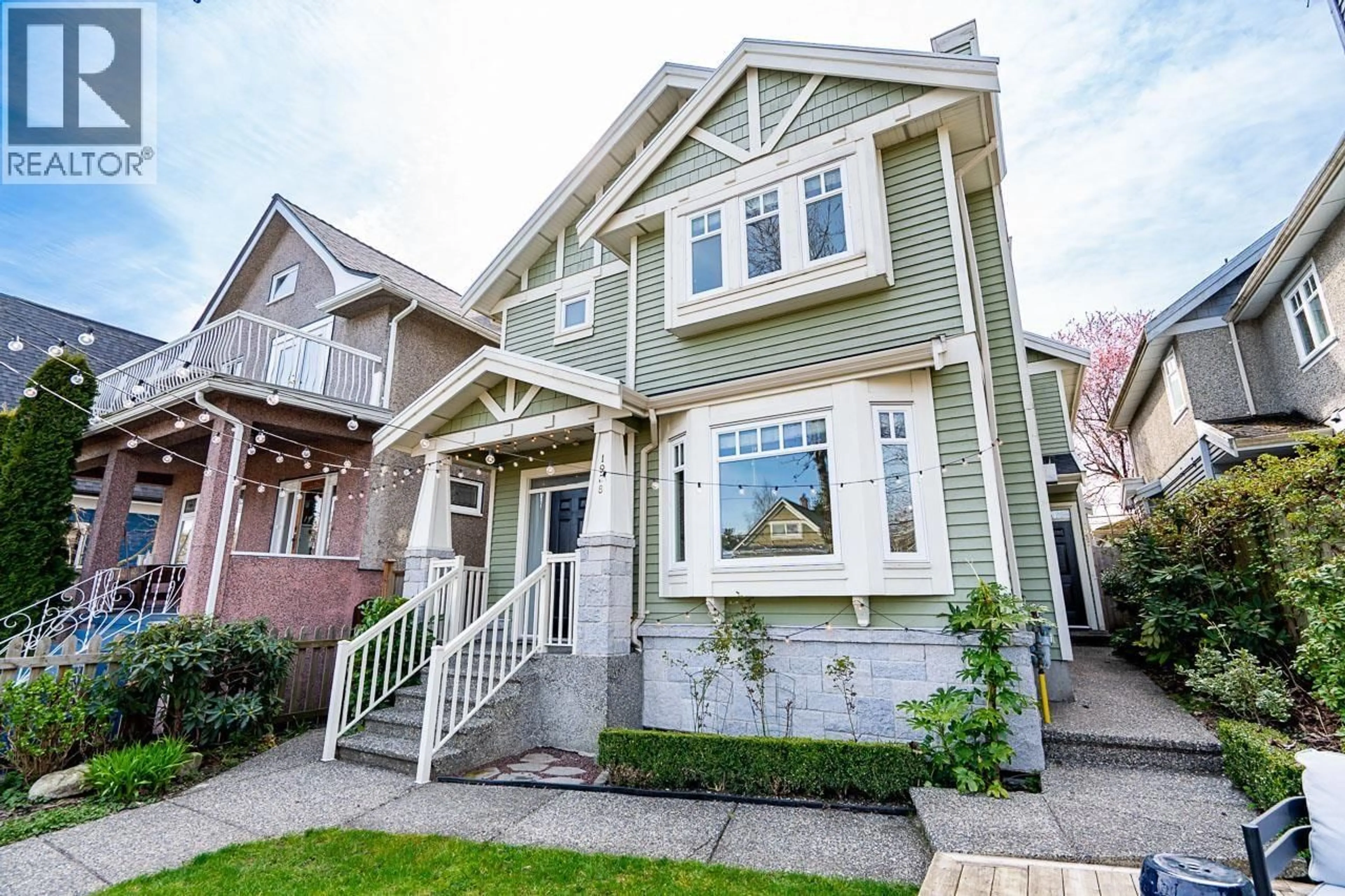 Home with vinyl exterior material, street for 1938 ADANAC STREET, Vancouver British Columbia V5L2E4