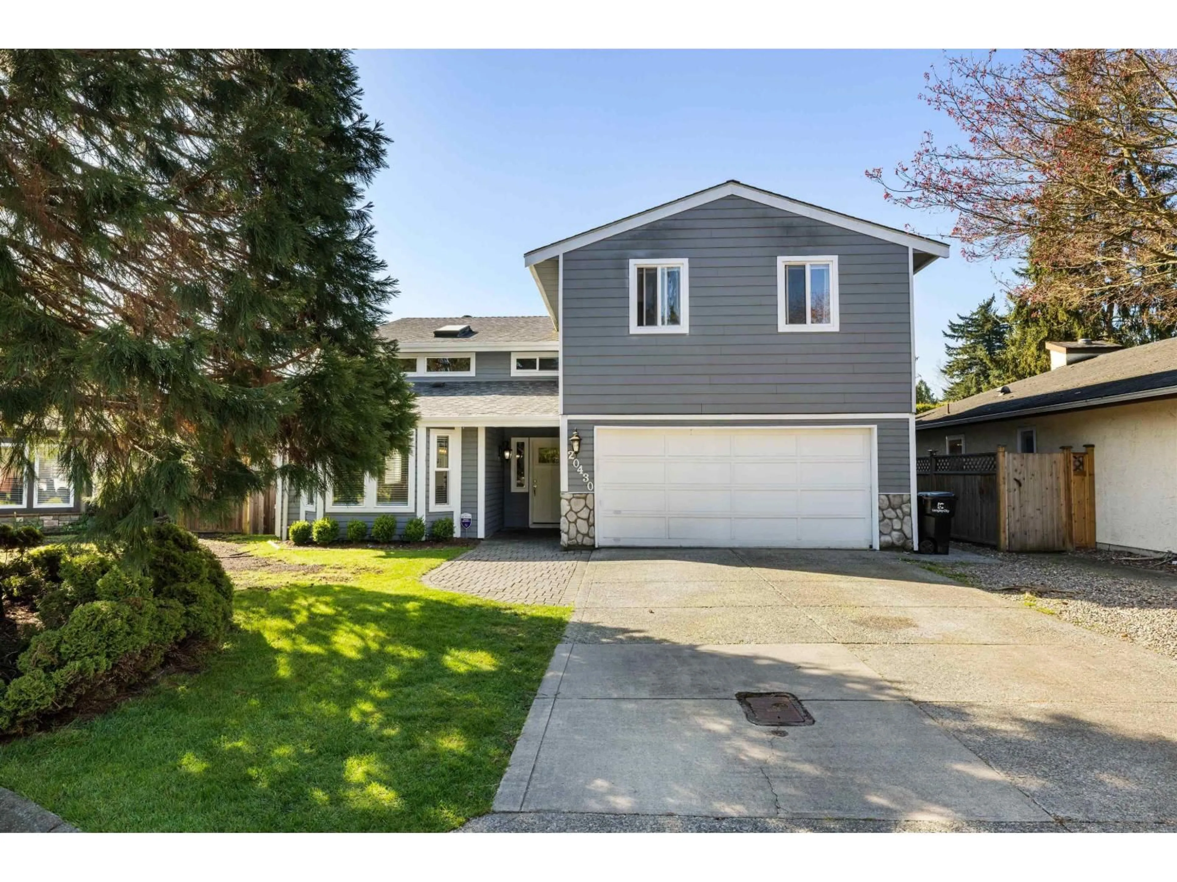 Home with vinyl exterior material, street for 20430 50 AVENUE, Langley British Columbia V3A7J3