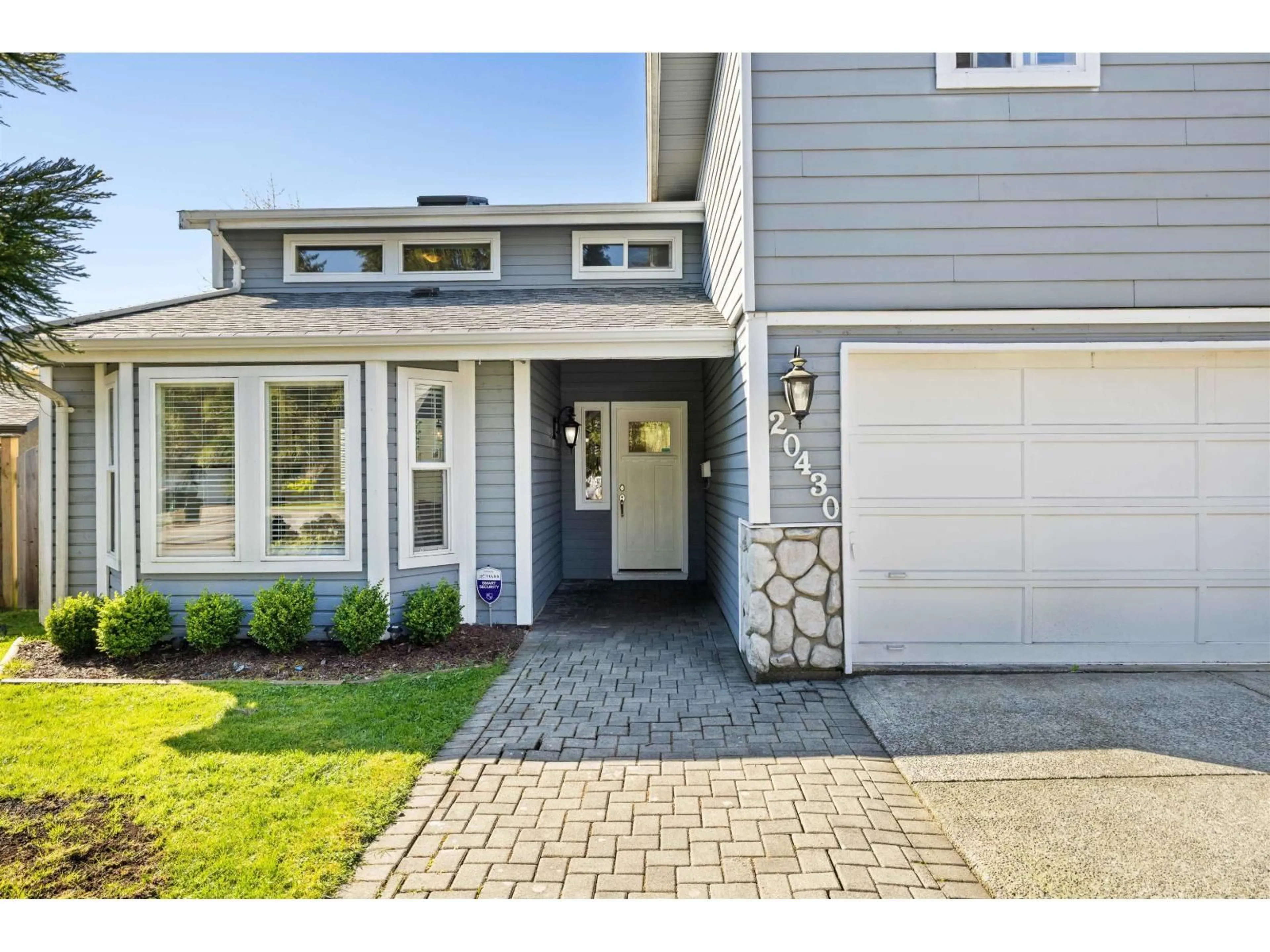 Home with vinyl exterior material, street for 20430 50 AVENUE, Langley British Columbia V3A7J3