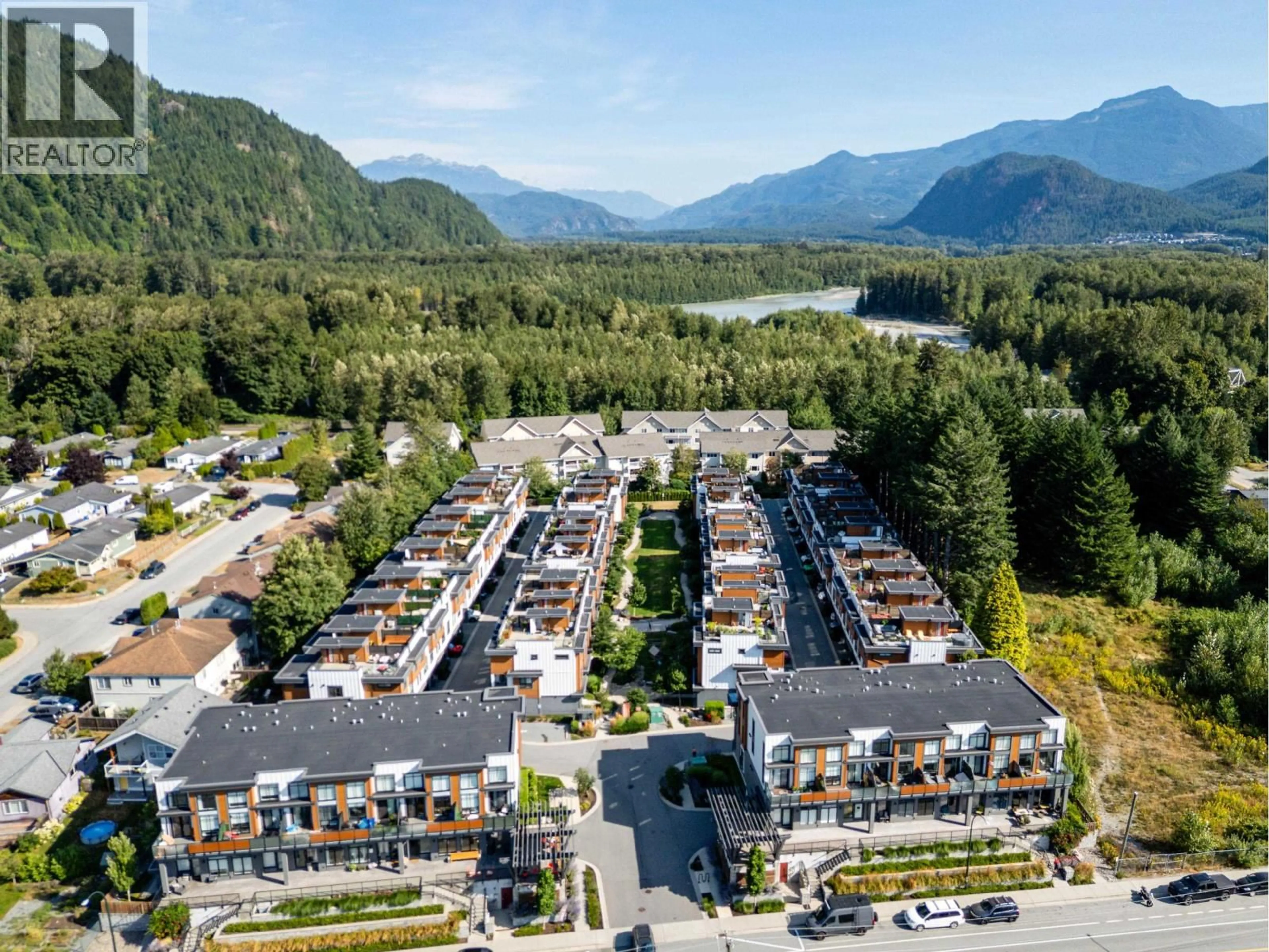 A pic from outside/outdoor area/front of a property/back of a property/a pic from drone, mountain view for 204 - 39767 GOVERNMENT ROAD, Squamish British Columbia V8B0Z1