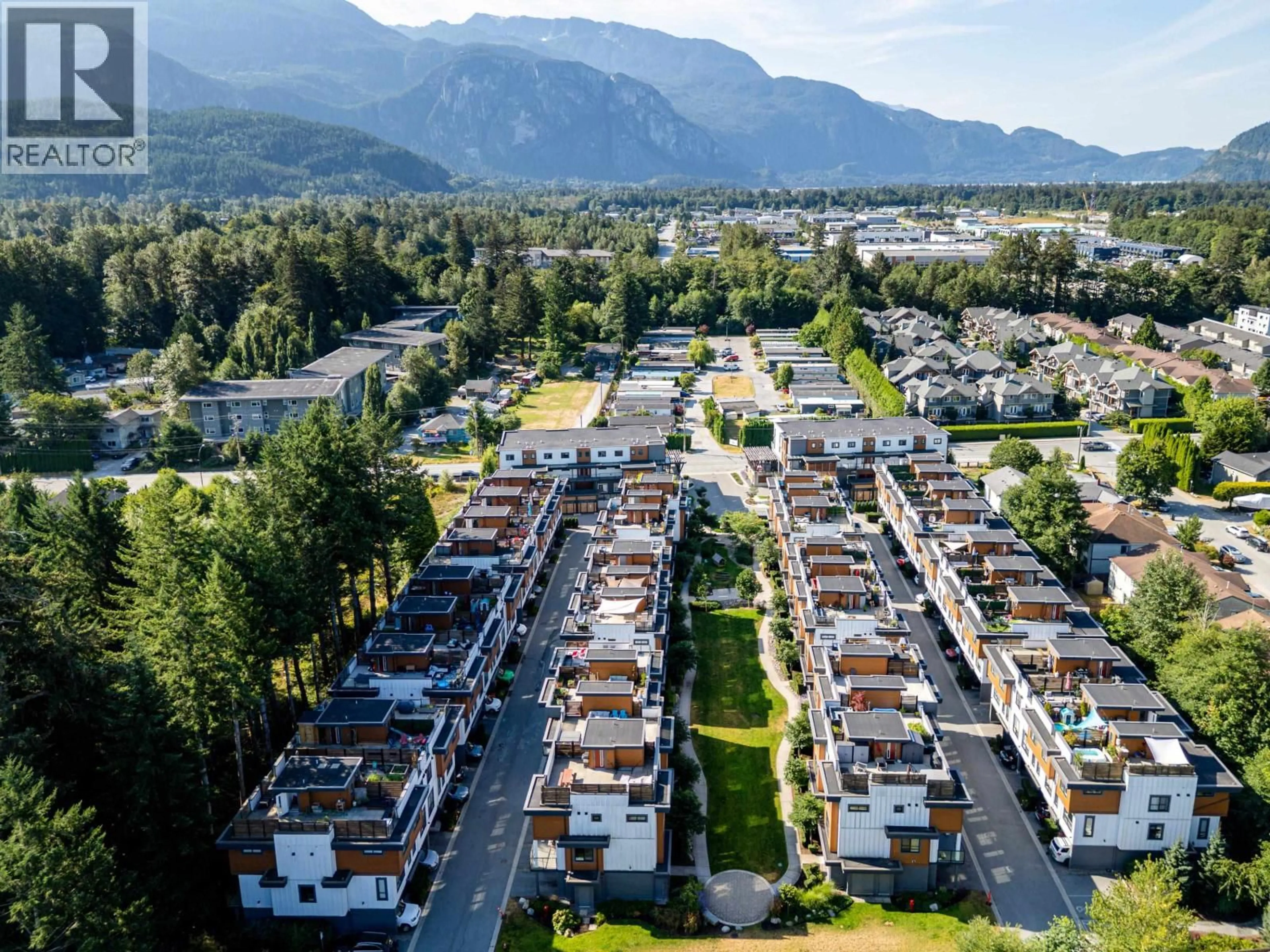 A pic from outside/outdoor area/front of a property/back of a property/a pic from drone, mountain view for 204 - 39767 GOVERNMENT ROAD, Squamish British Columbia V8B0Z1