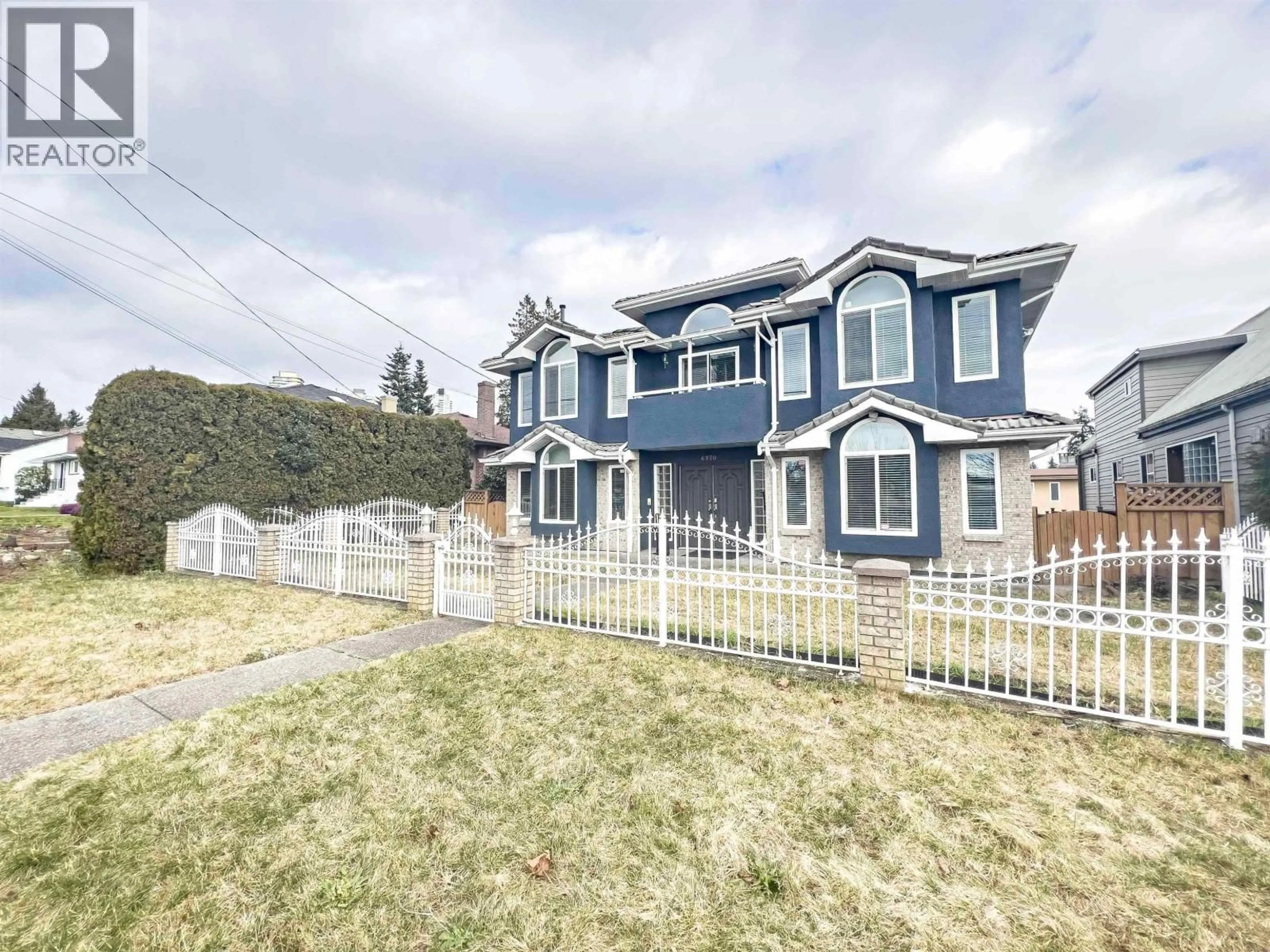 Home with vinyl exterior material, street for 6970 WILLINGDON AVENUE, Burnaby British Columbia V5J3R2