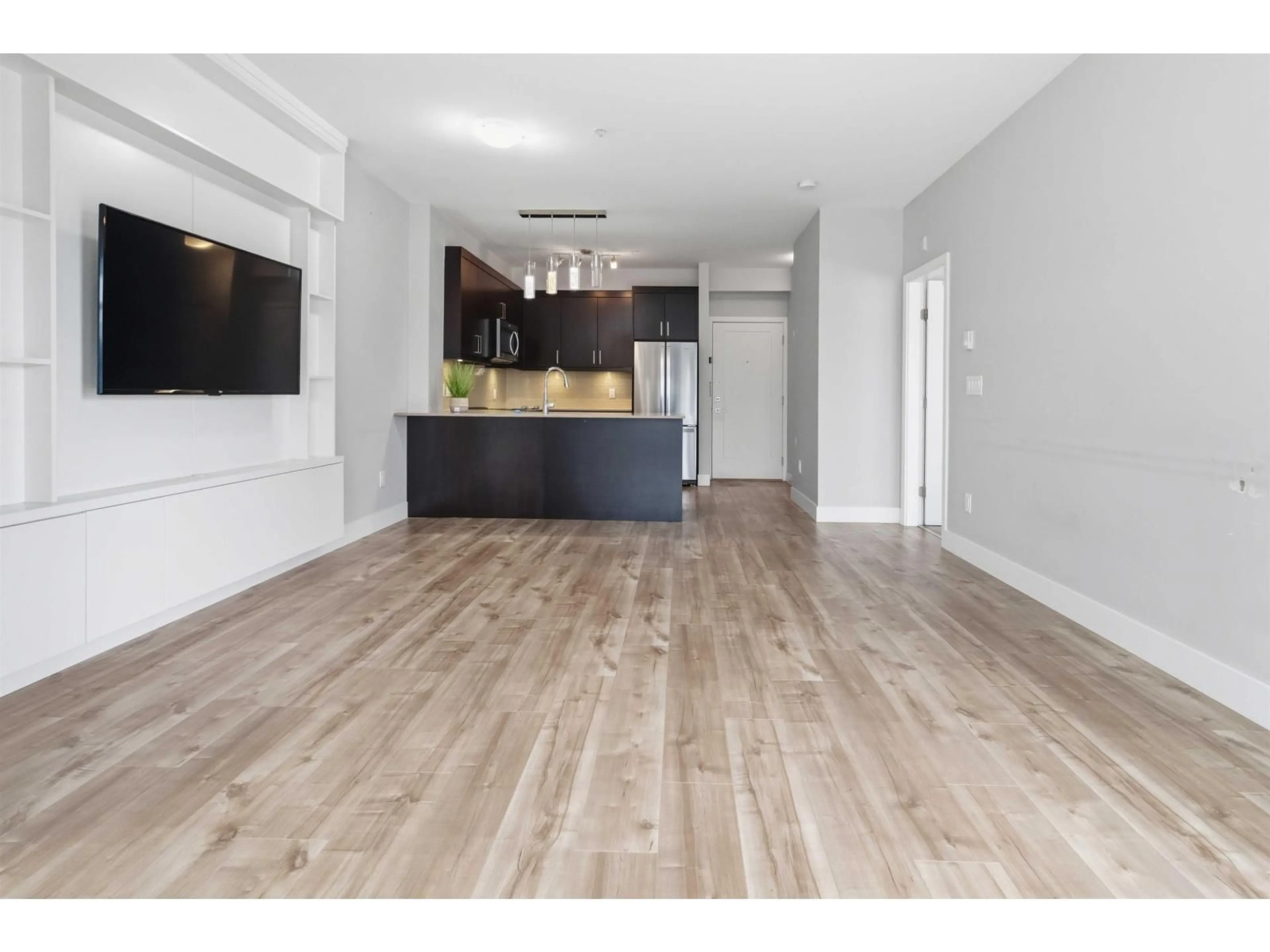 Open concept kitchen, wood/laminate floor for 214 - 9015 120 STREET, Delta British Columbia V4C0E3