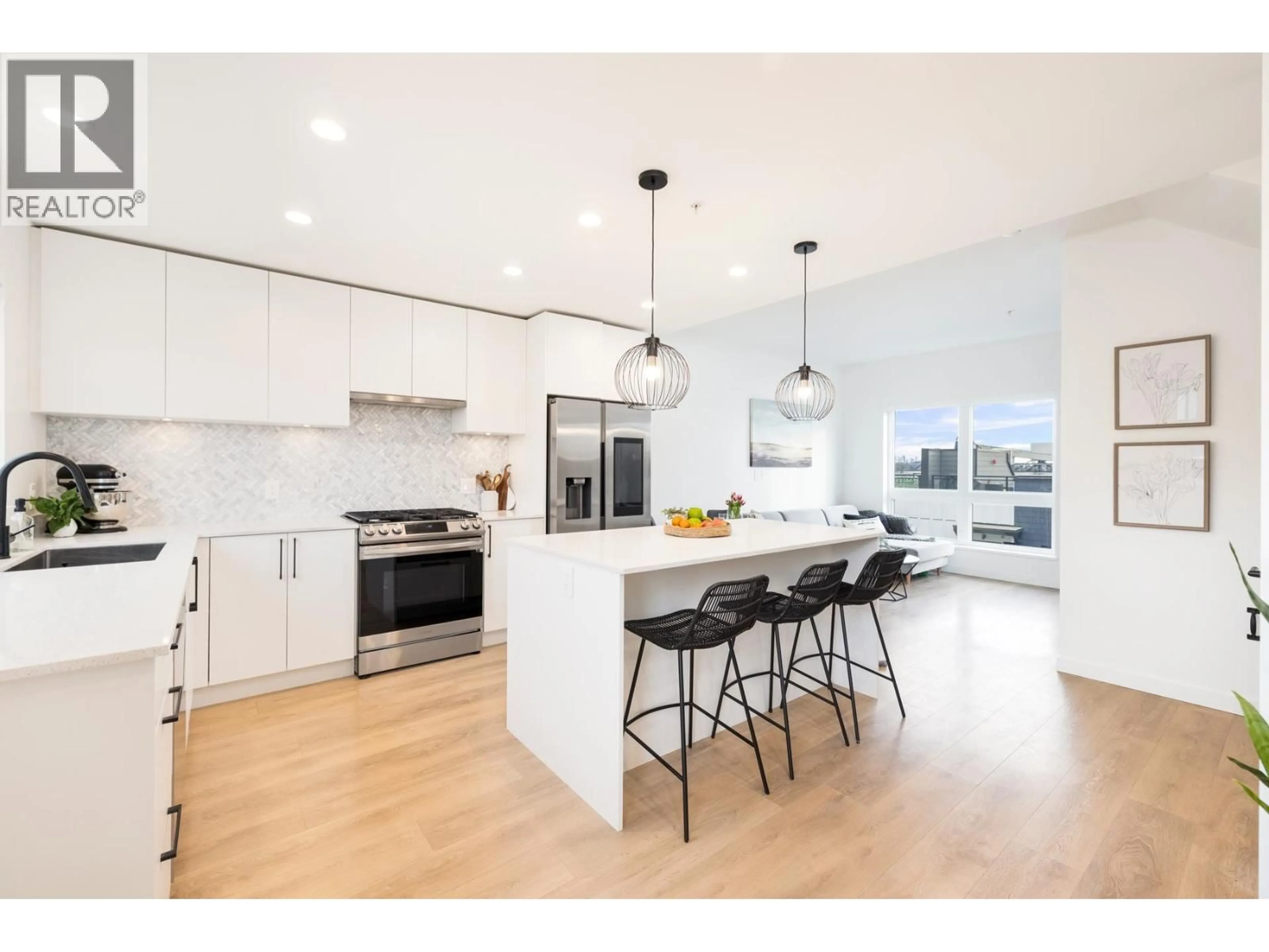 Open concept kitchen, wood/laminate floor for 444 - 545 2ND STREET, North Vancouver British Columbia V7L1E1