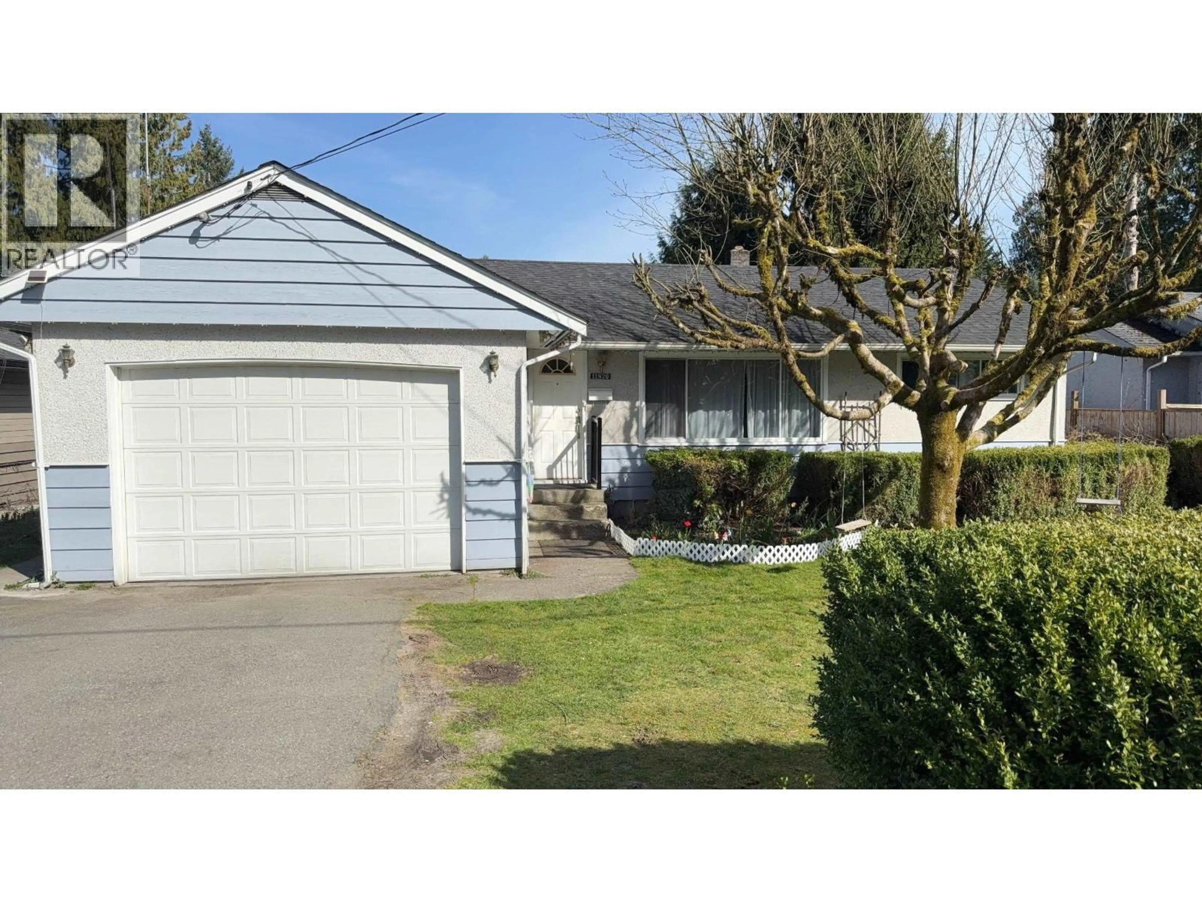 Home with vinyl exterior material, street for 11820 207 STREET, Maple Ridge British Columbia V2X1X5