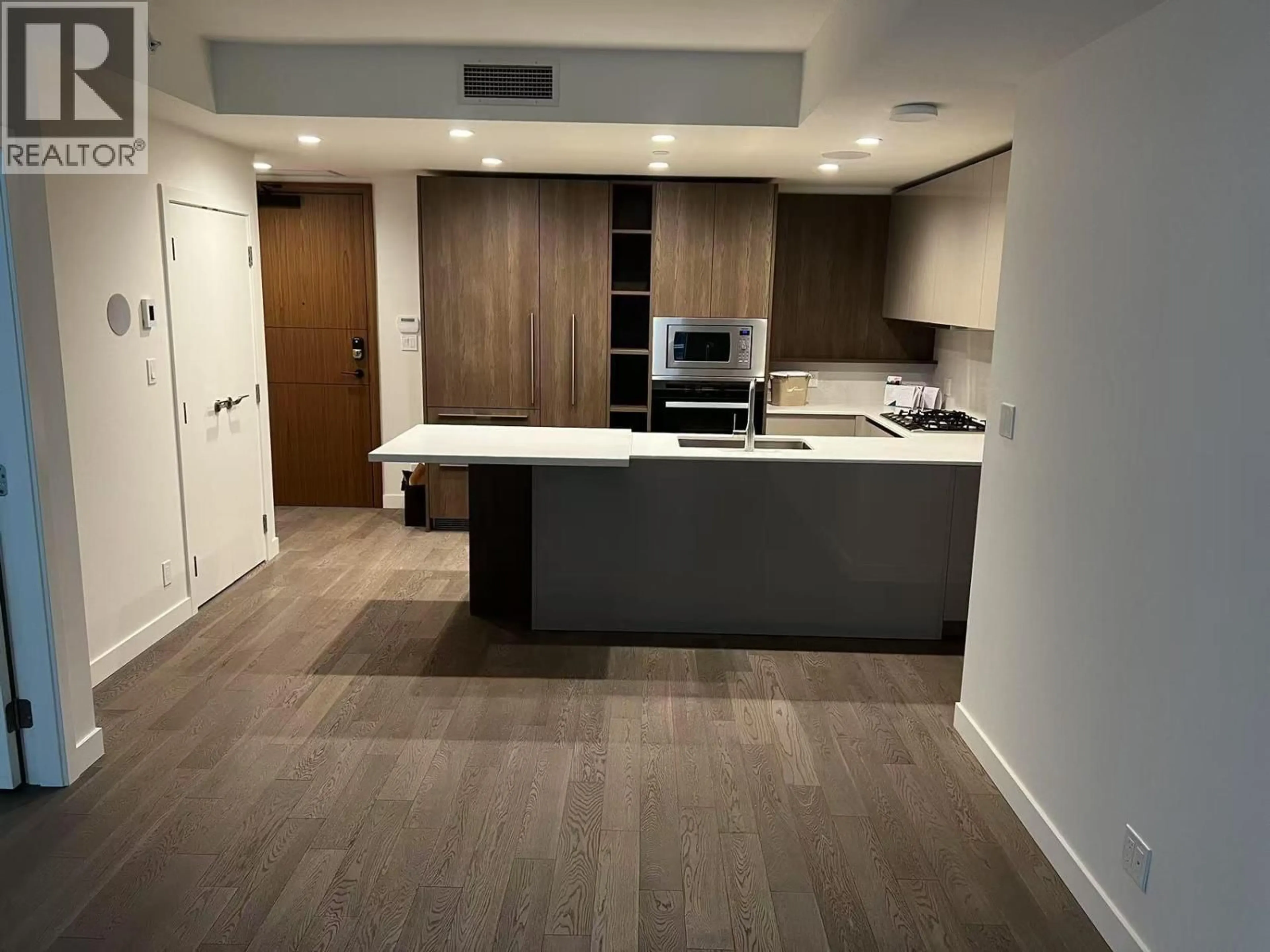 Open concept kitchen, wood/laminate floor for 315 - 6833 PEARSON WAY, Richmond British Columbia V7C0E8