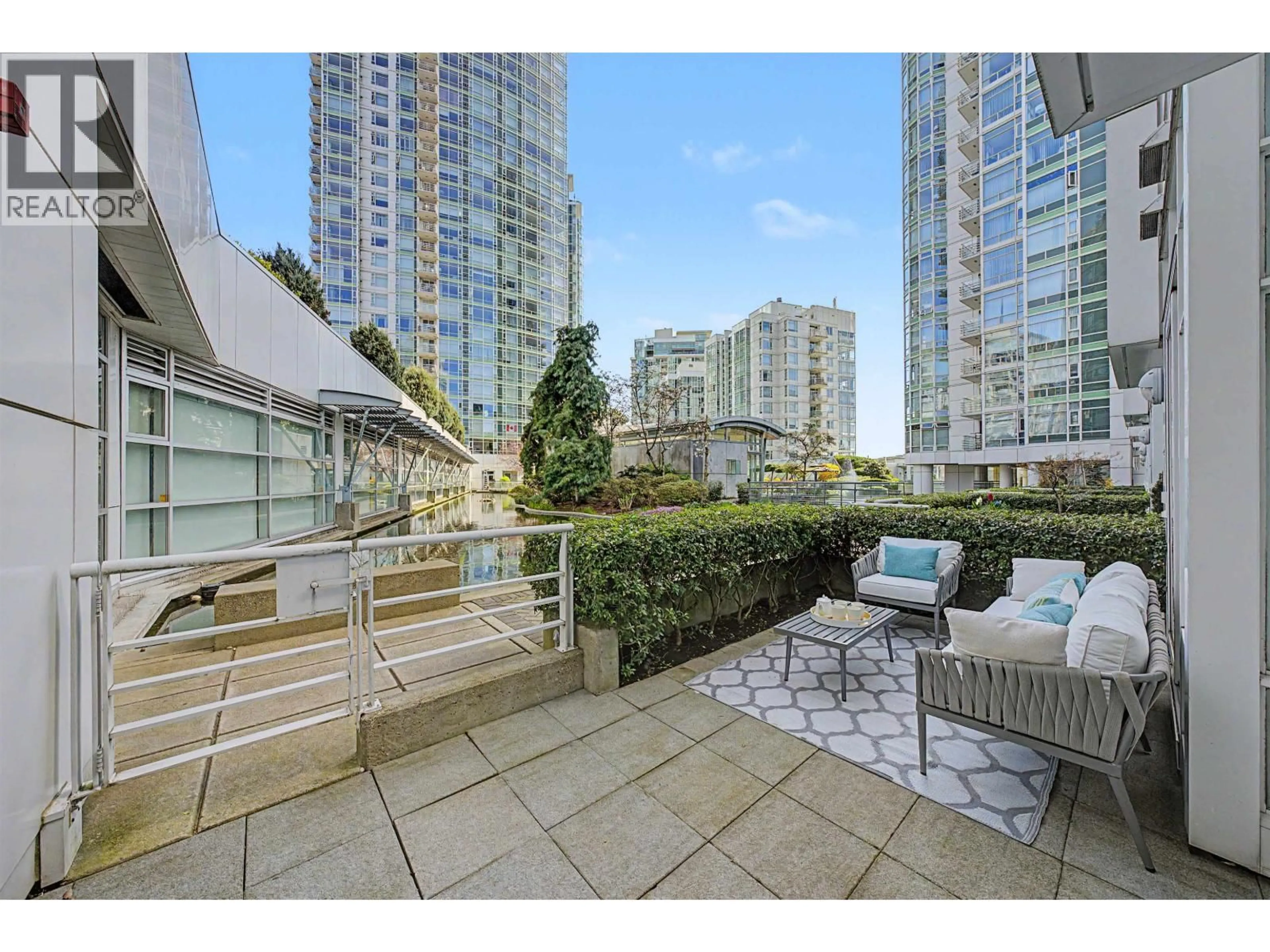 Patio, city buildings view from balcony for TH A - 1199 MARINASIDE CRESCENT, Vancouver British Columbia V6Z2Y2