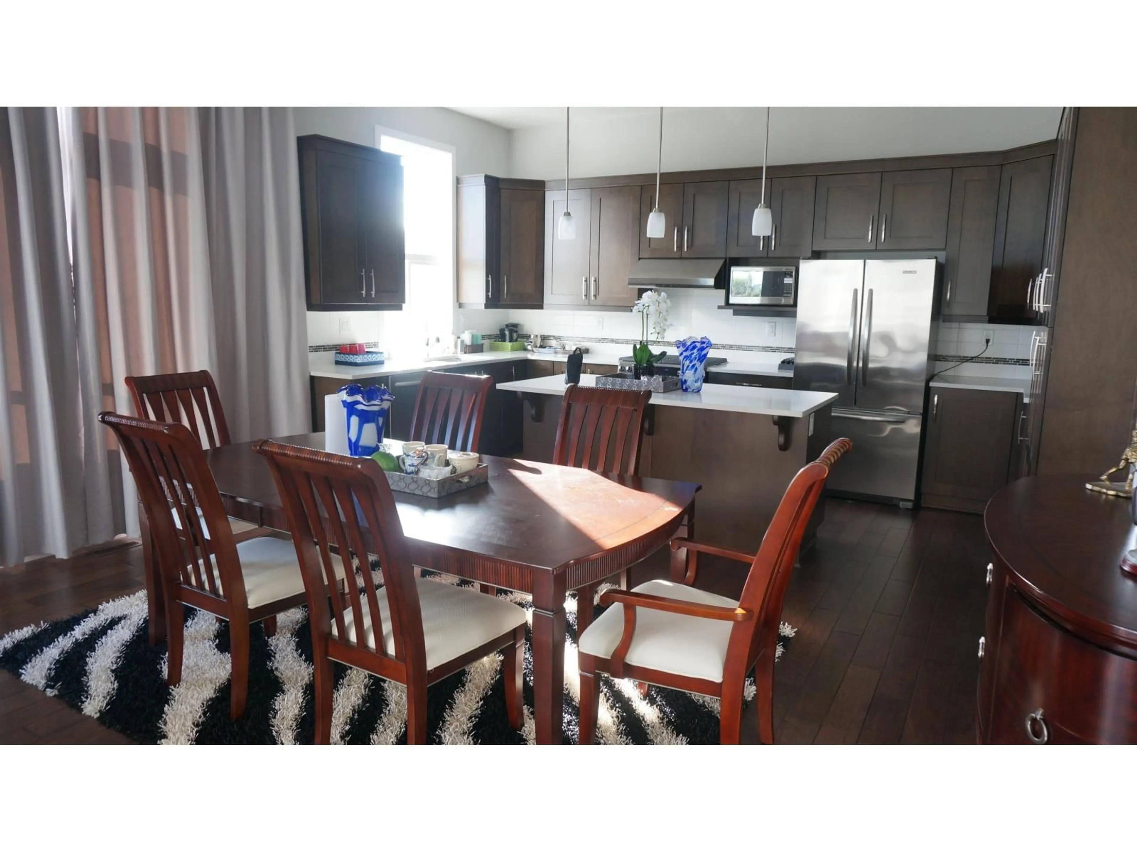 Open concept kitchen, wood/laminate floor for 16988 77A AVENUE, Surrey British Columbia V4N6L2