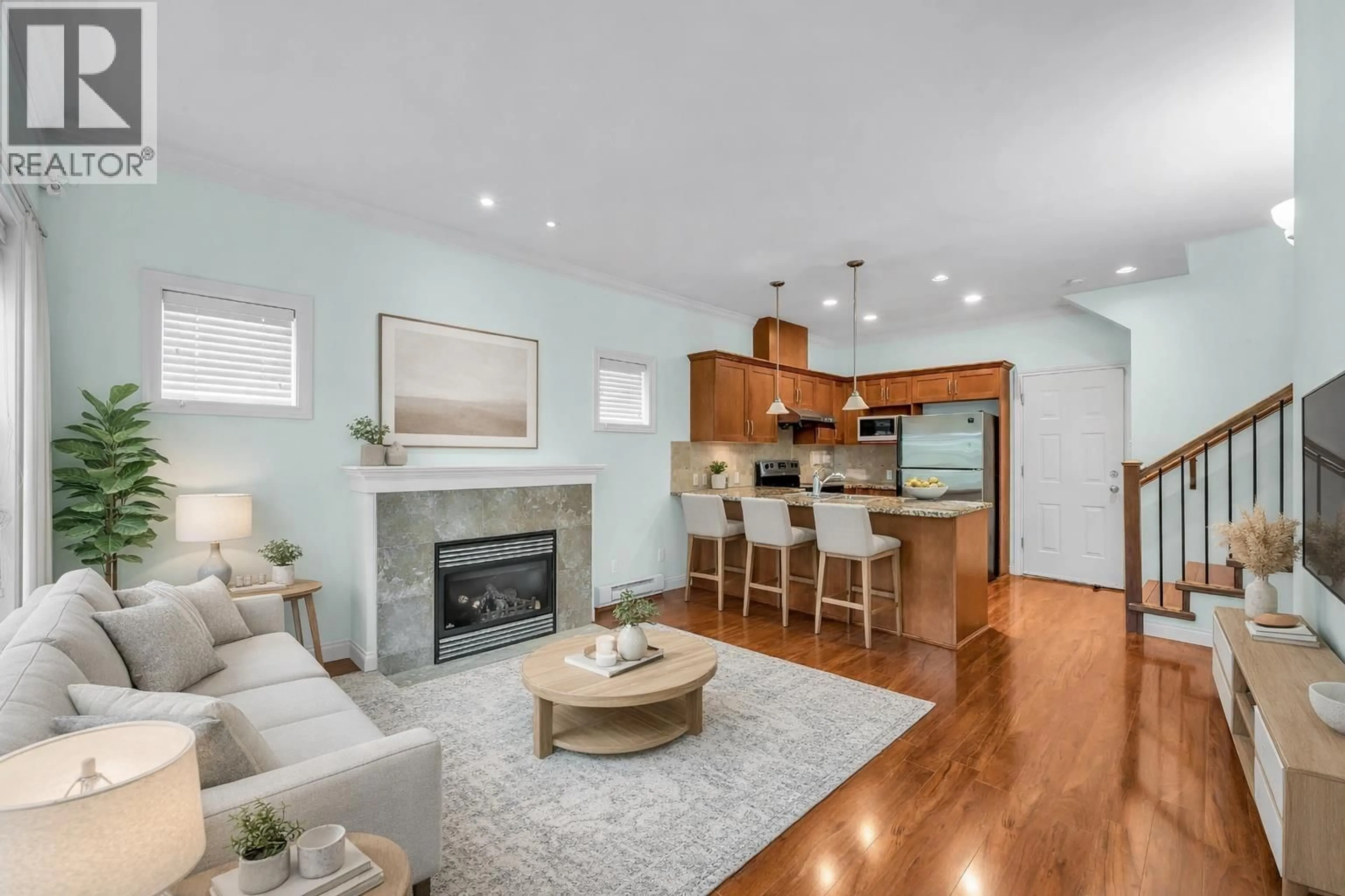 Living room with furniture, wood/laminate floor for 1 - 8311 NO. 2 ROAD, Richmond British Columbia V7C3M2