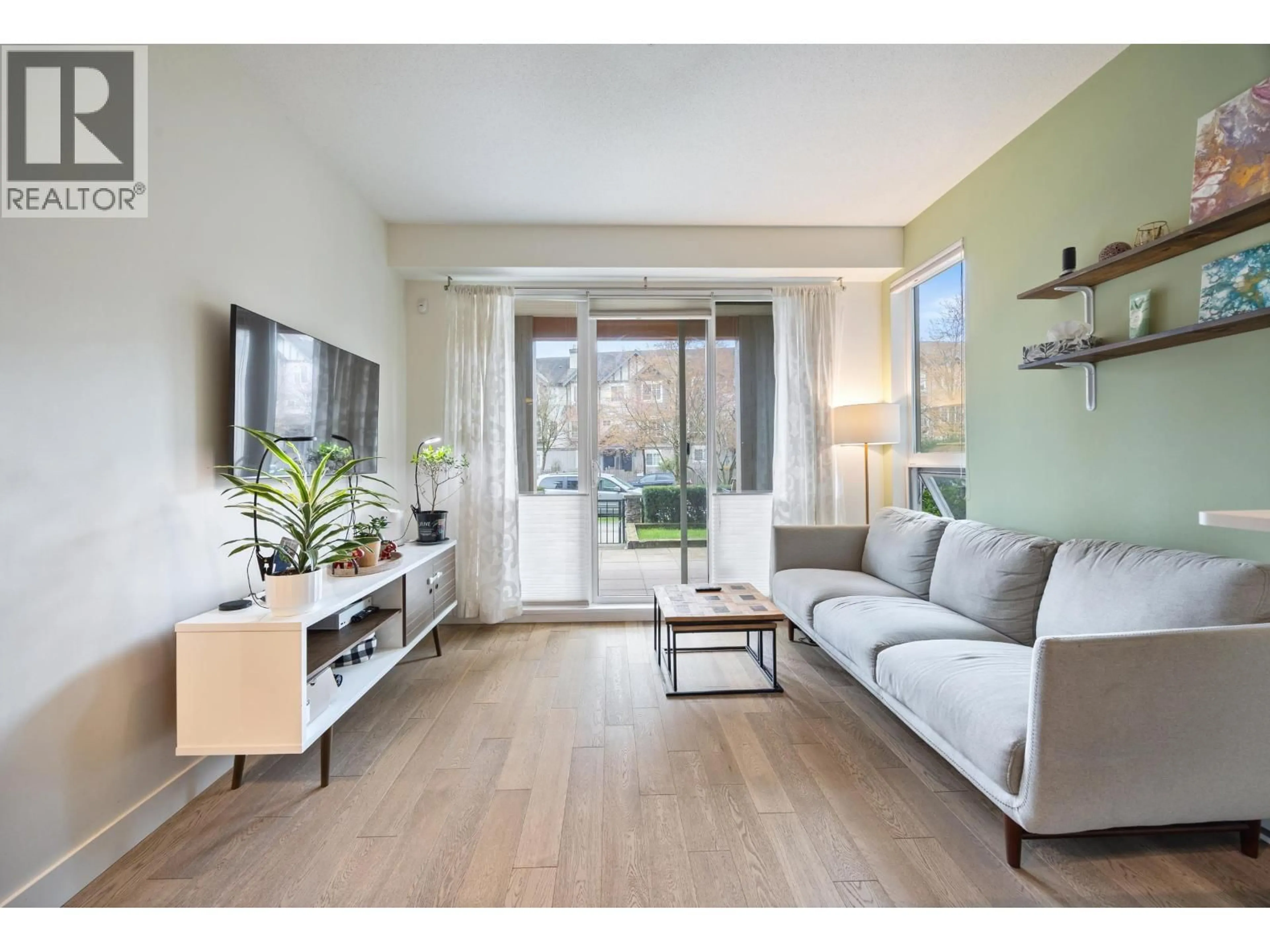 Living room with furniture, wood/laminate floor for 209 - 3399 NOEL DRIVE, Burnaby British Columbia V3J0G8