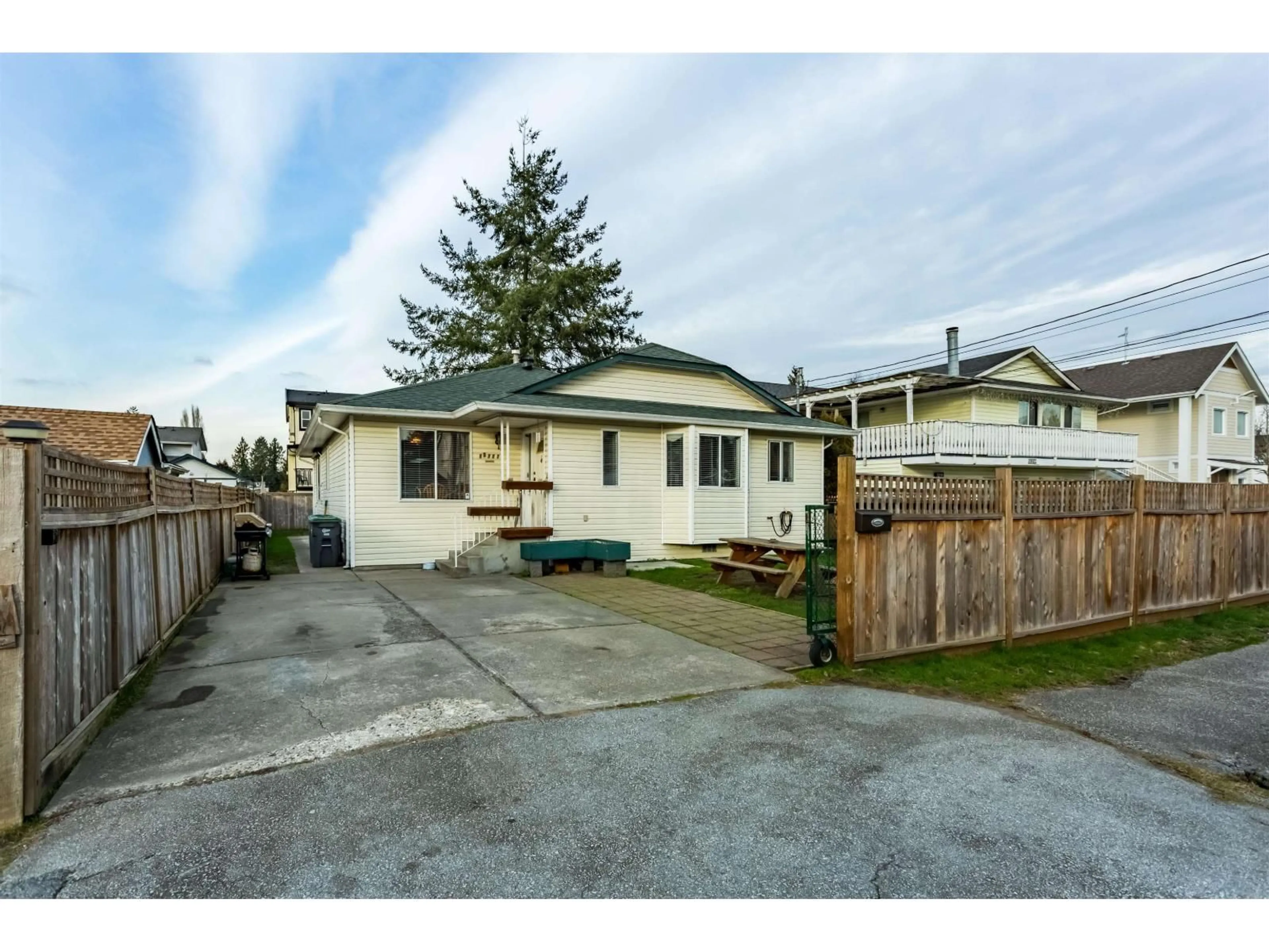 A pic from outside/outdoor area/front of a property/back of a property/a pic from drone, street for 12717 114 AVENUE, Surrey British Columbia V3V3P2